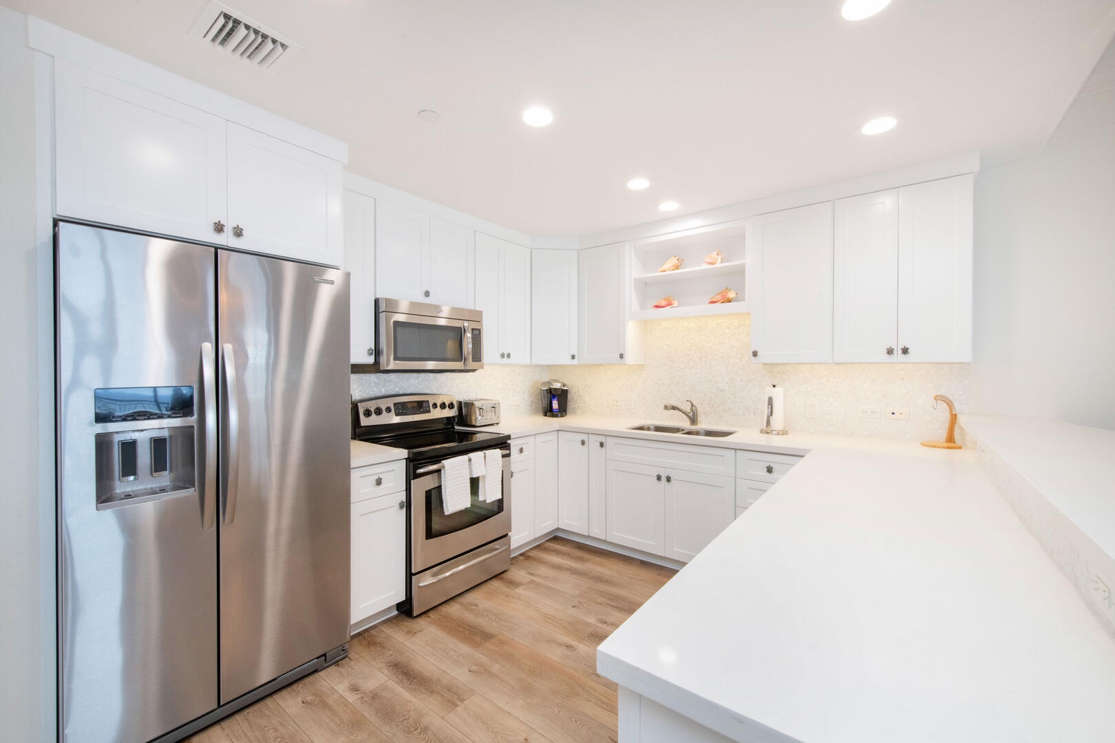 Full kitchen with modern appliances.
