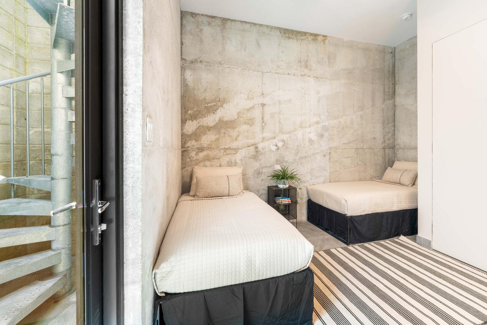 Suites 5 & 6 each come furnished with 2 twin beds, televisions, private entryway, and ensuite bathrooms.