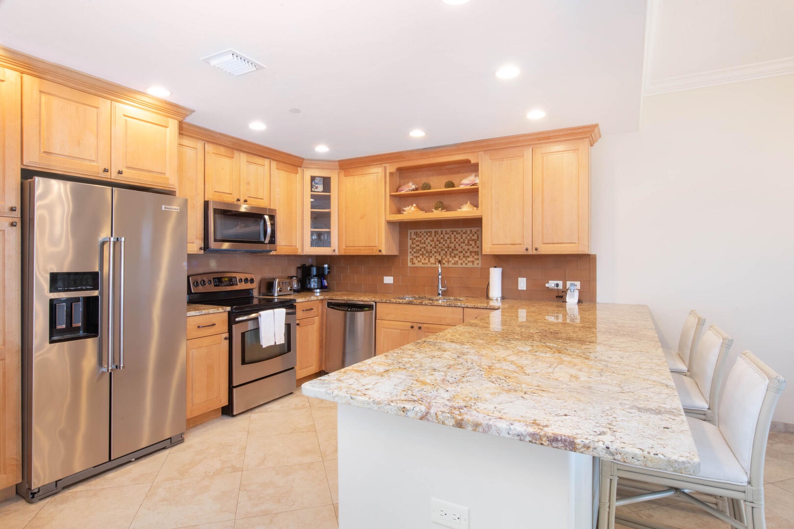 Full kitchen with modern appliances.