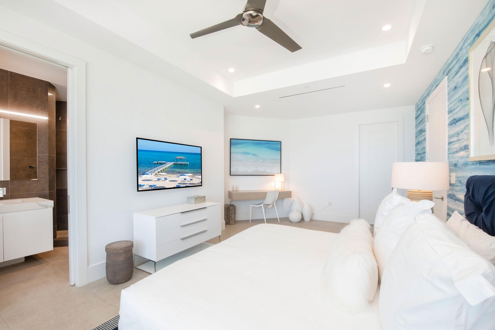 Primary Suite #1 is furnished with a desk + chair perfect for work-from-home professionals.