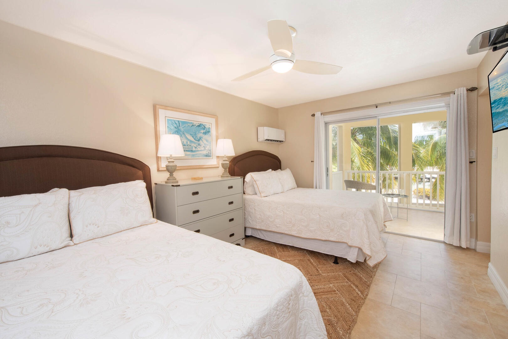 The guest suite also features a private balcony overlooking the screened lanai.