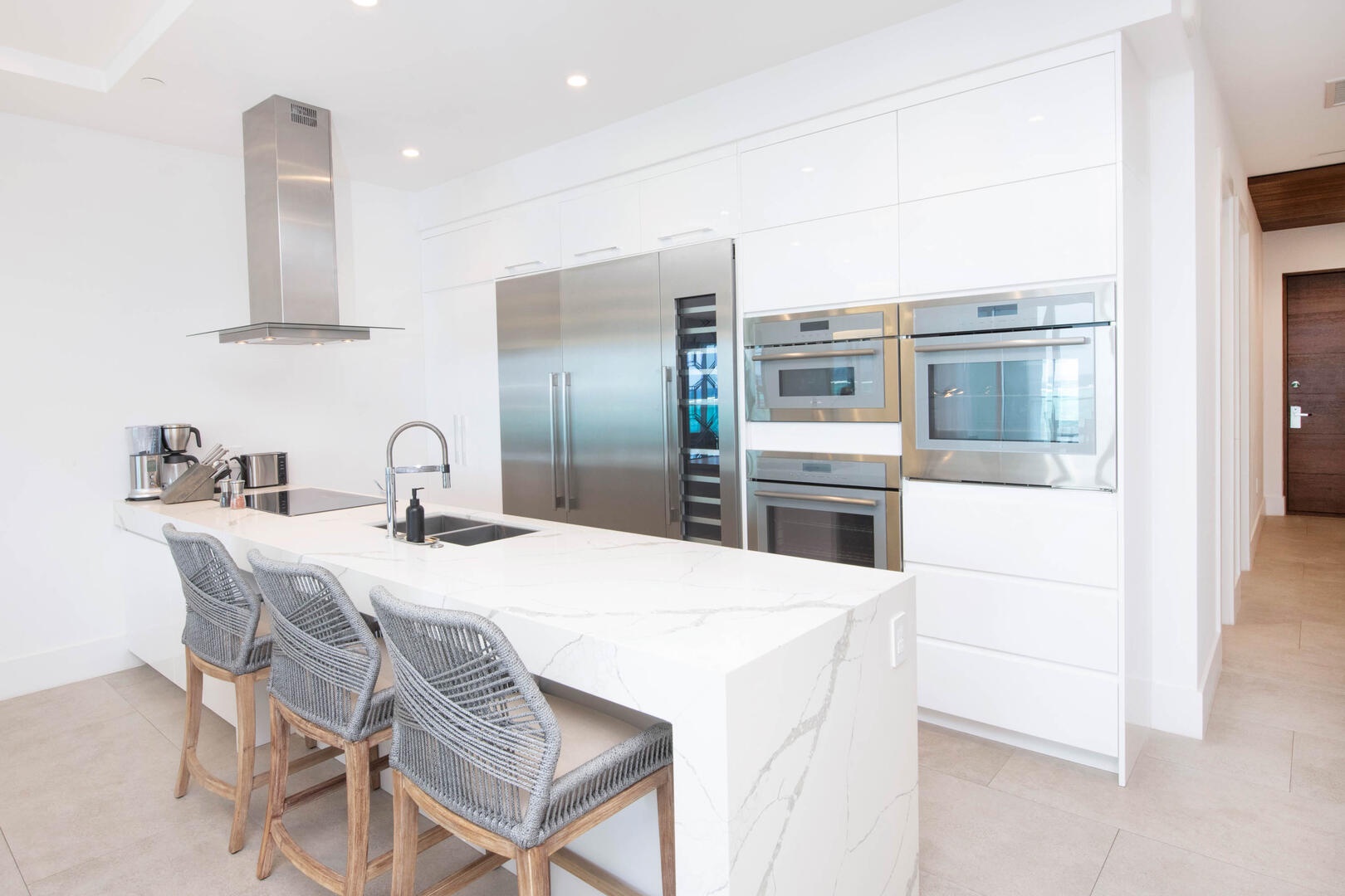 Gourmet kitchen with top-of-the-line appliances and island seating for 3.