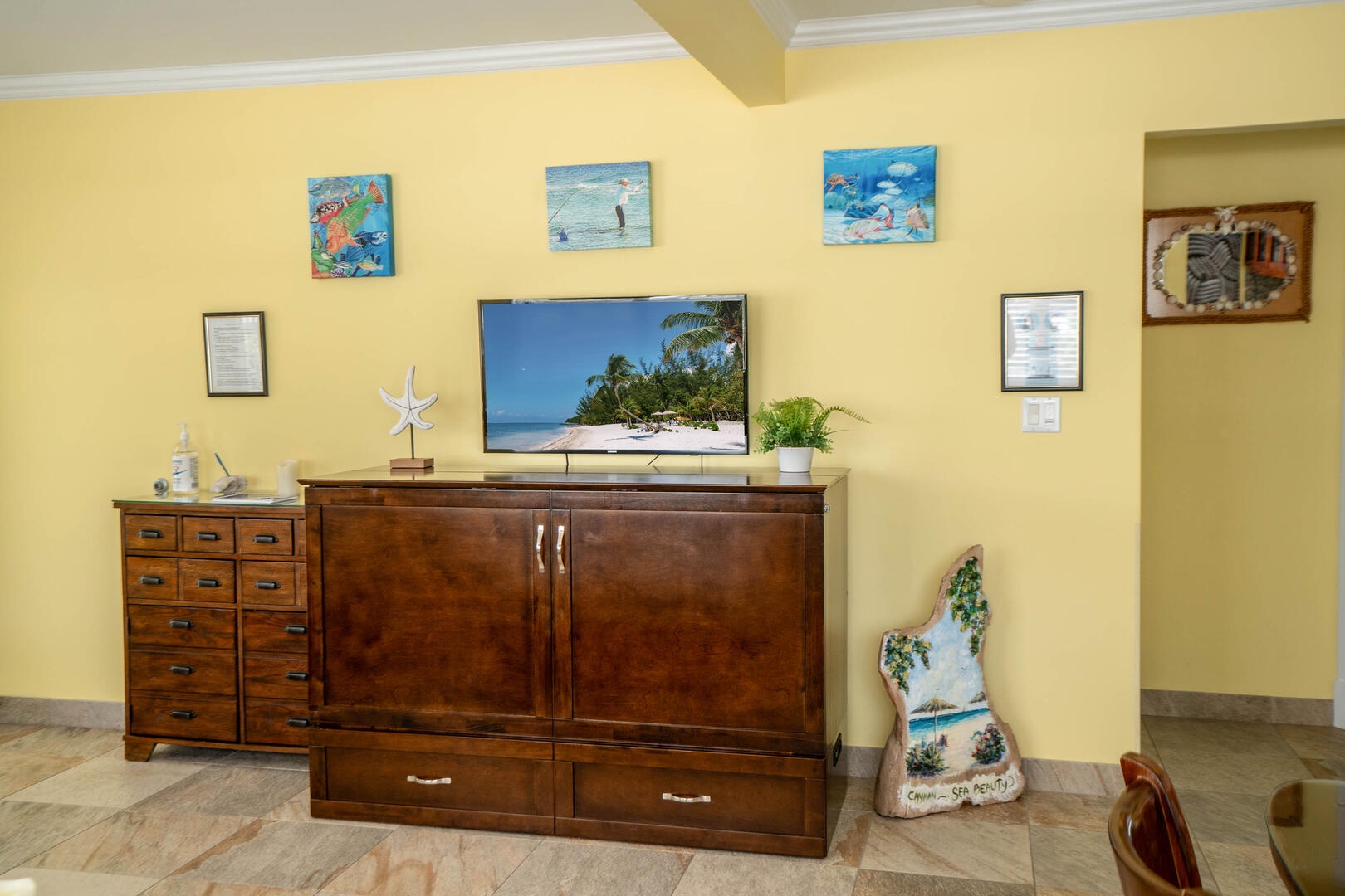 Living room entertainment cabinet with HD cable television.