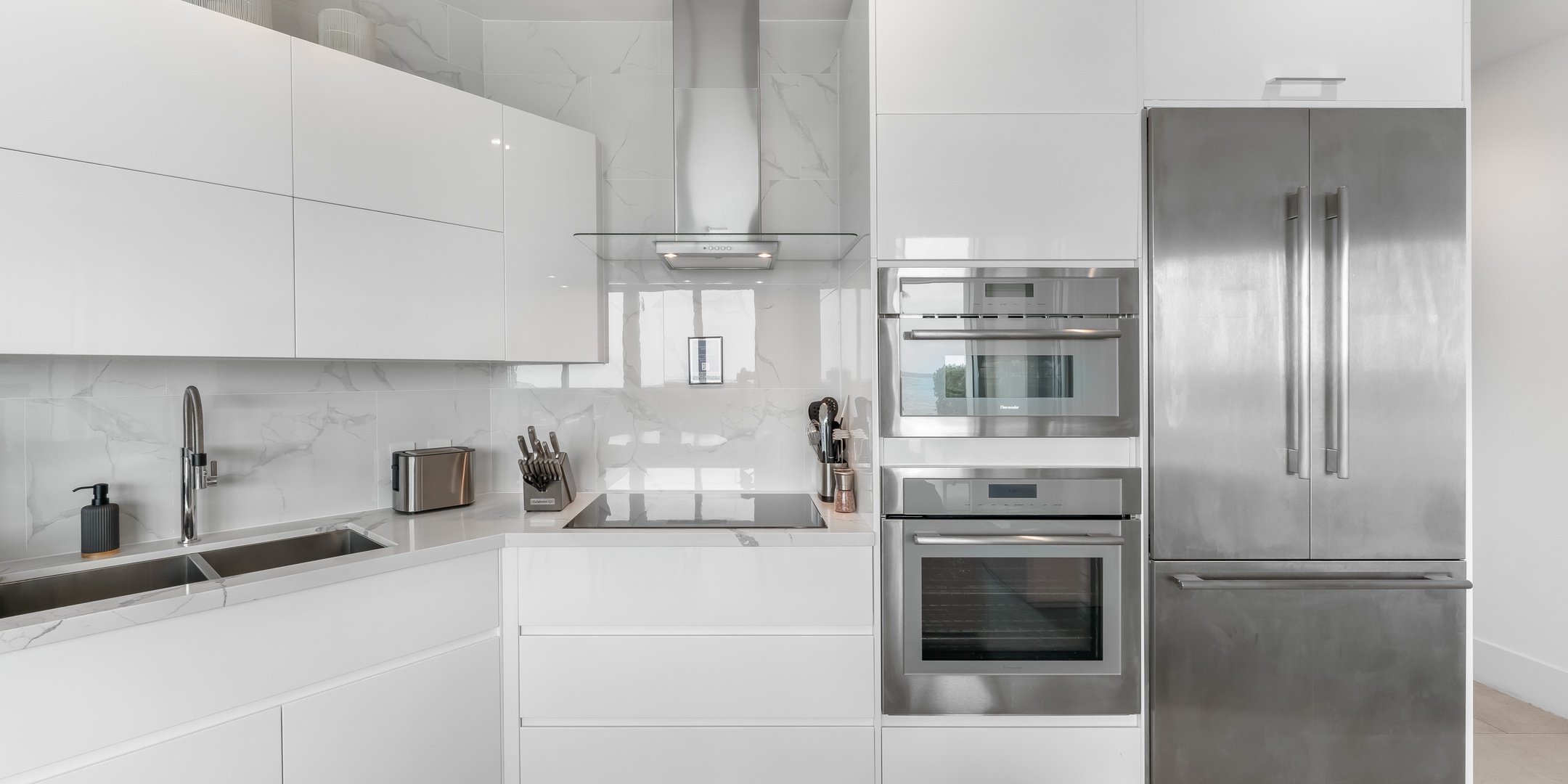 Full kitchen with modern appliances.