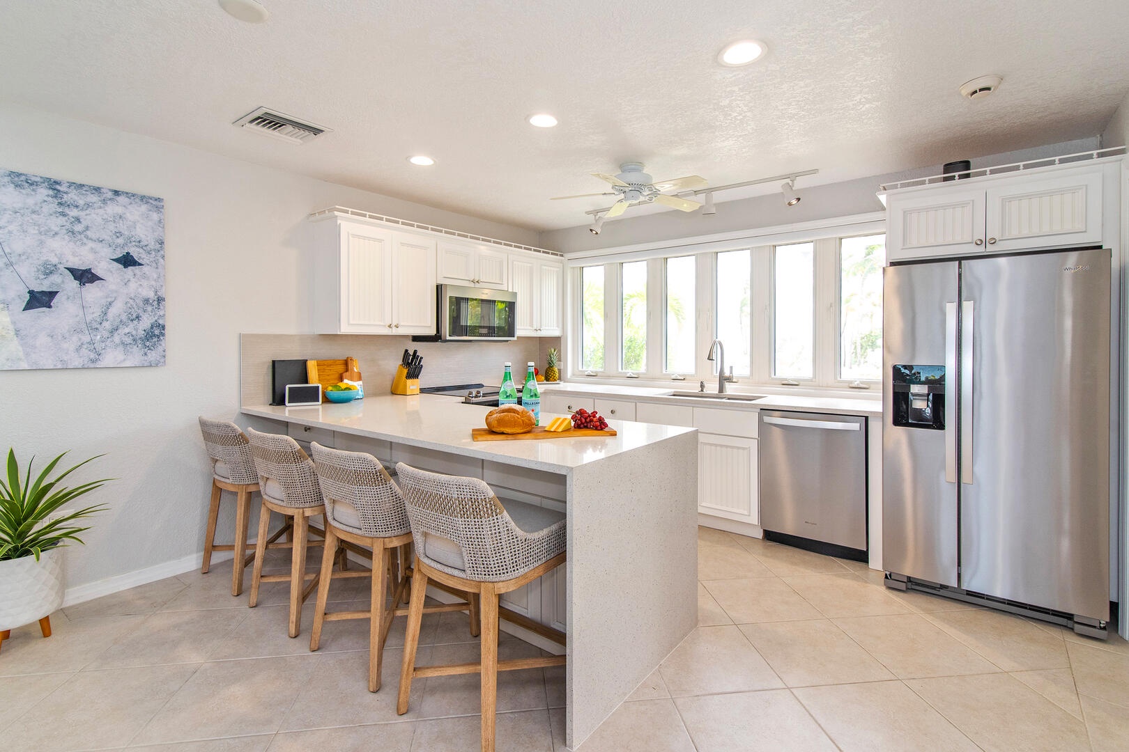 Newly remodeled kitchen with breakfast counter seating.
