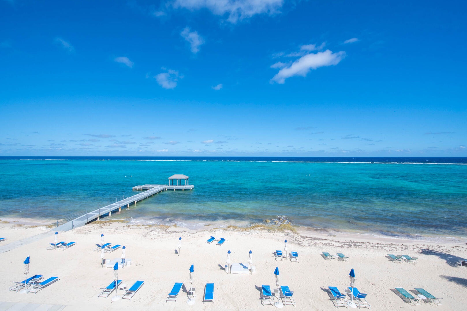 View of the resort's beachfront with beach service set up daily for guests only.