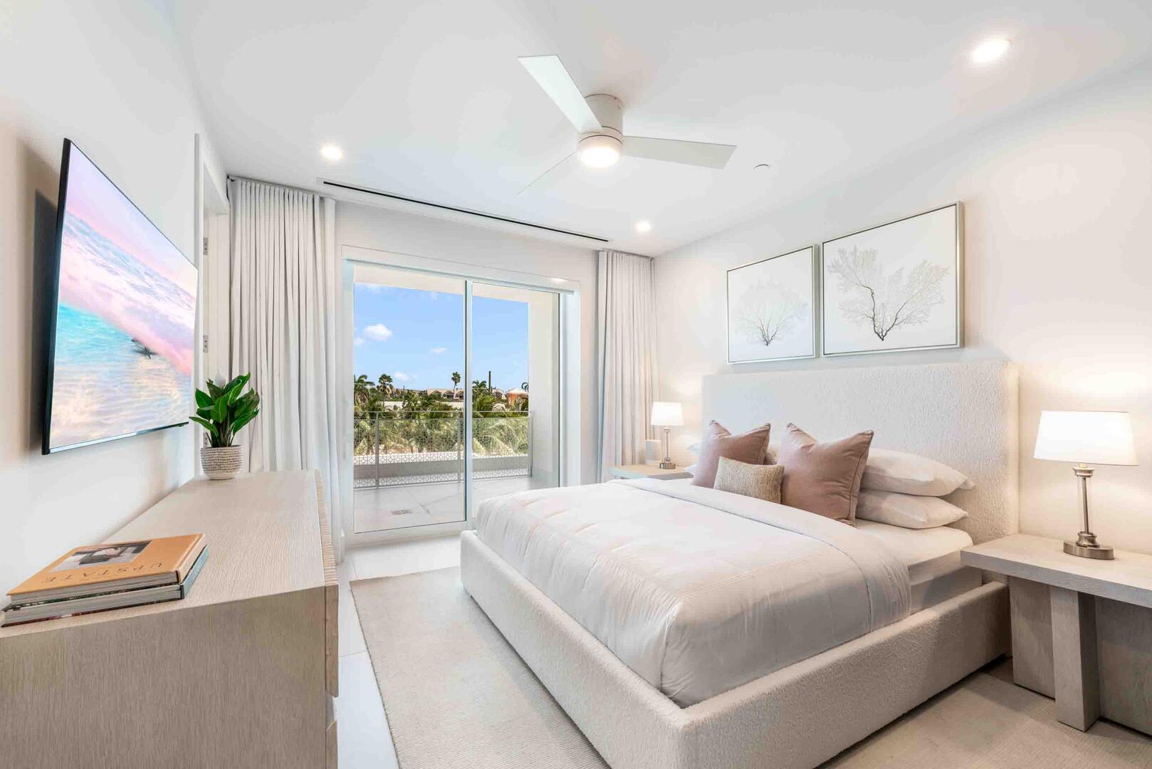 Bedroom 3 features a king bed, SmartTV, and walkout access to a land-side balcony.