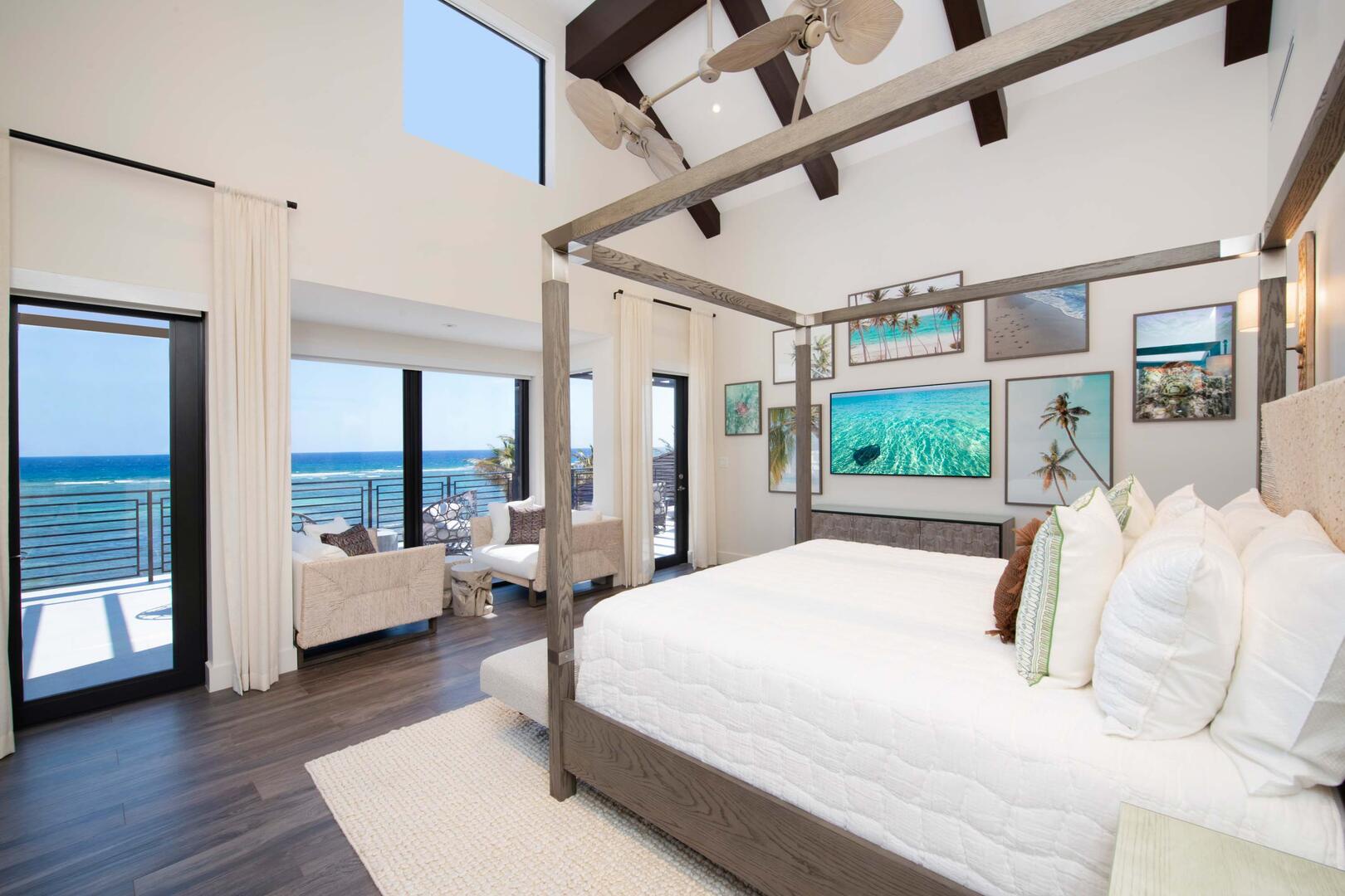 Primary Suite ? upper-level, king bed, oceanfront, vaulted ceilings, walk-out access to oceanfront railed balcony, cable connected Smart TV in hidden console, walk-in closet.