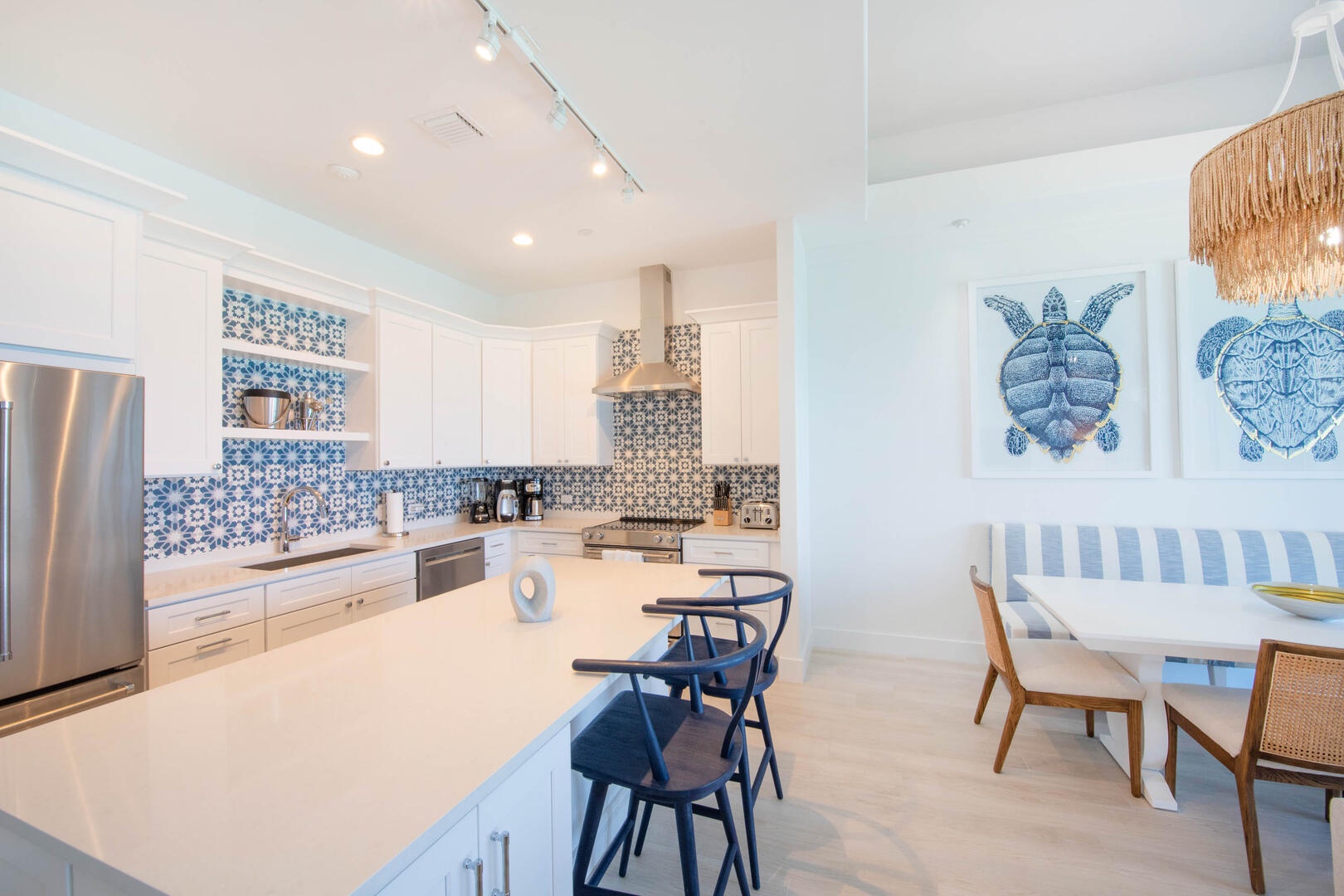 The kitchen comes stocked with dishware, cookware, glassware, and cutlery.