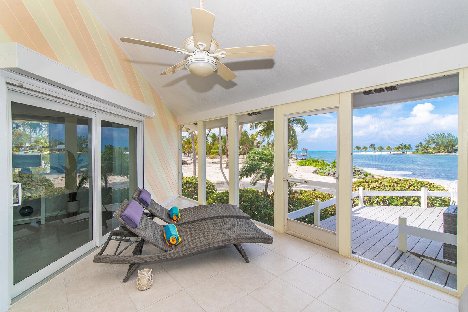 Sun loungers on the screened porch.