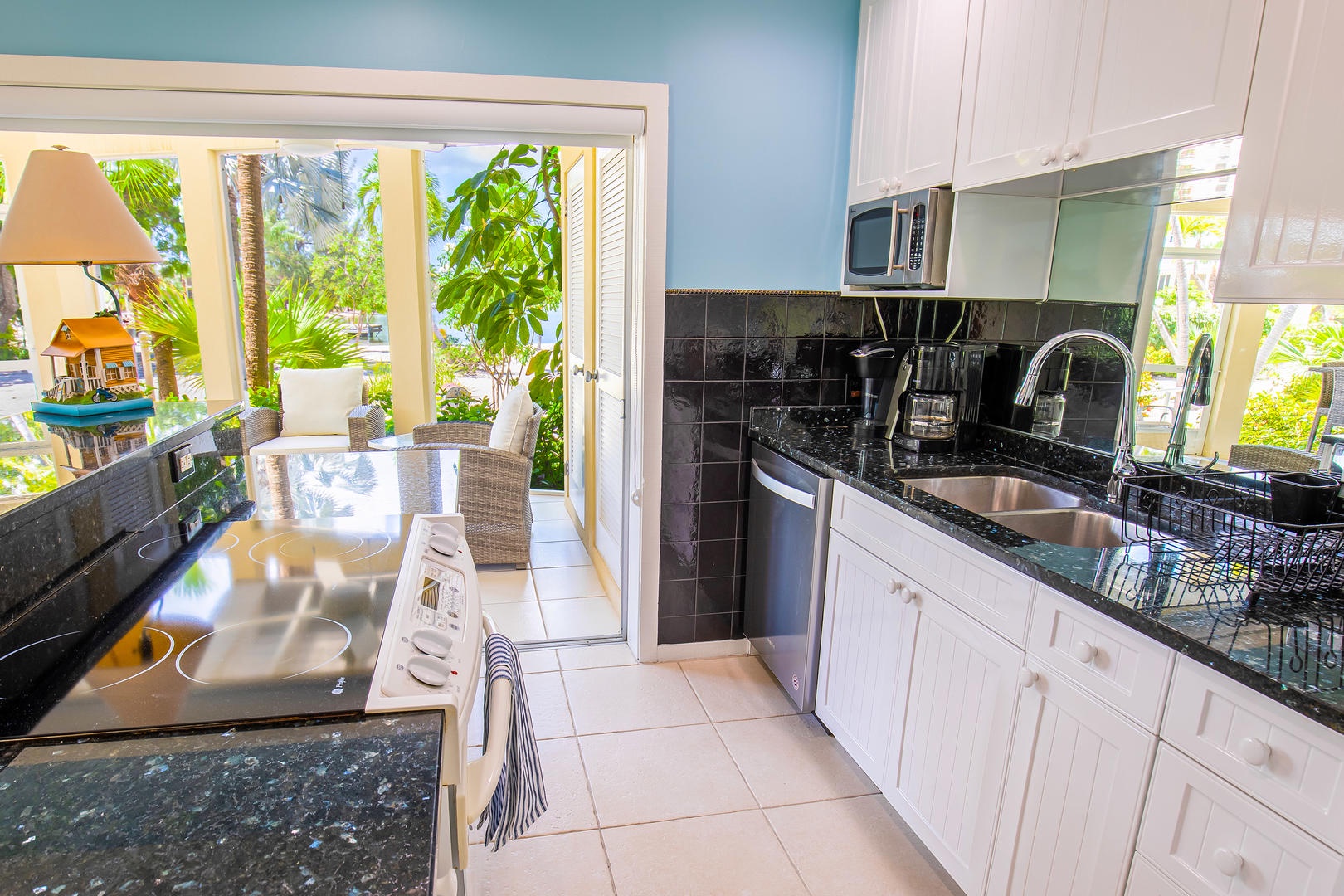 Full kitchen with modern appliances.