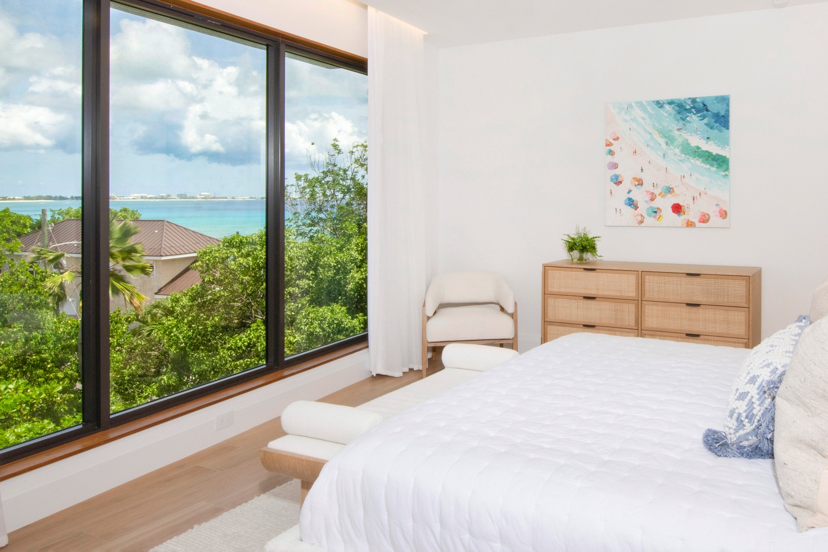 Primary suite with king bed and partial ocean views. All linens and bedding are provided for your stay.