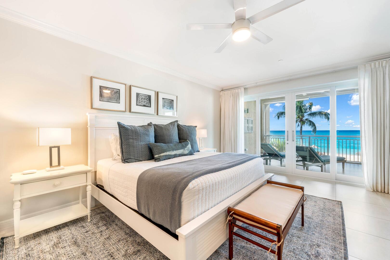 Primary Suite with king bed and walkout access to the ocean balcony.