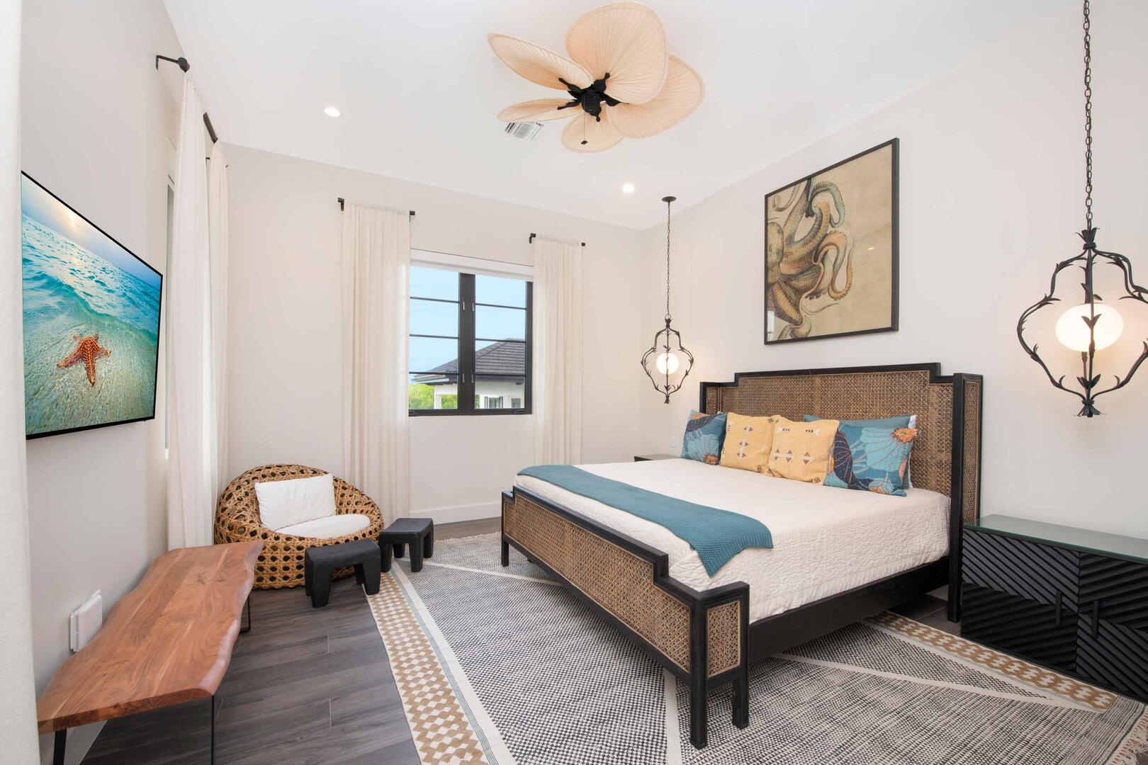 West Suite ? upper-level, king bed, oceanfront, vaulted ceilings, walk-out access to the oceanfront railed balcony, desk, double closets, SmartTV.