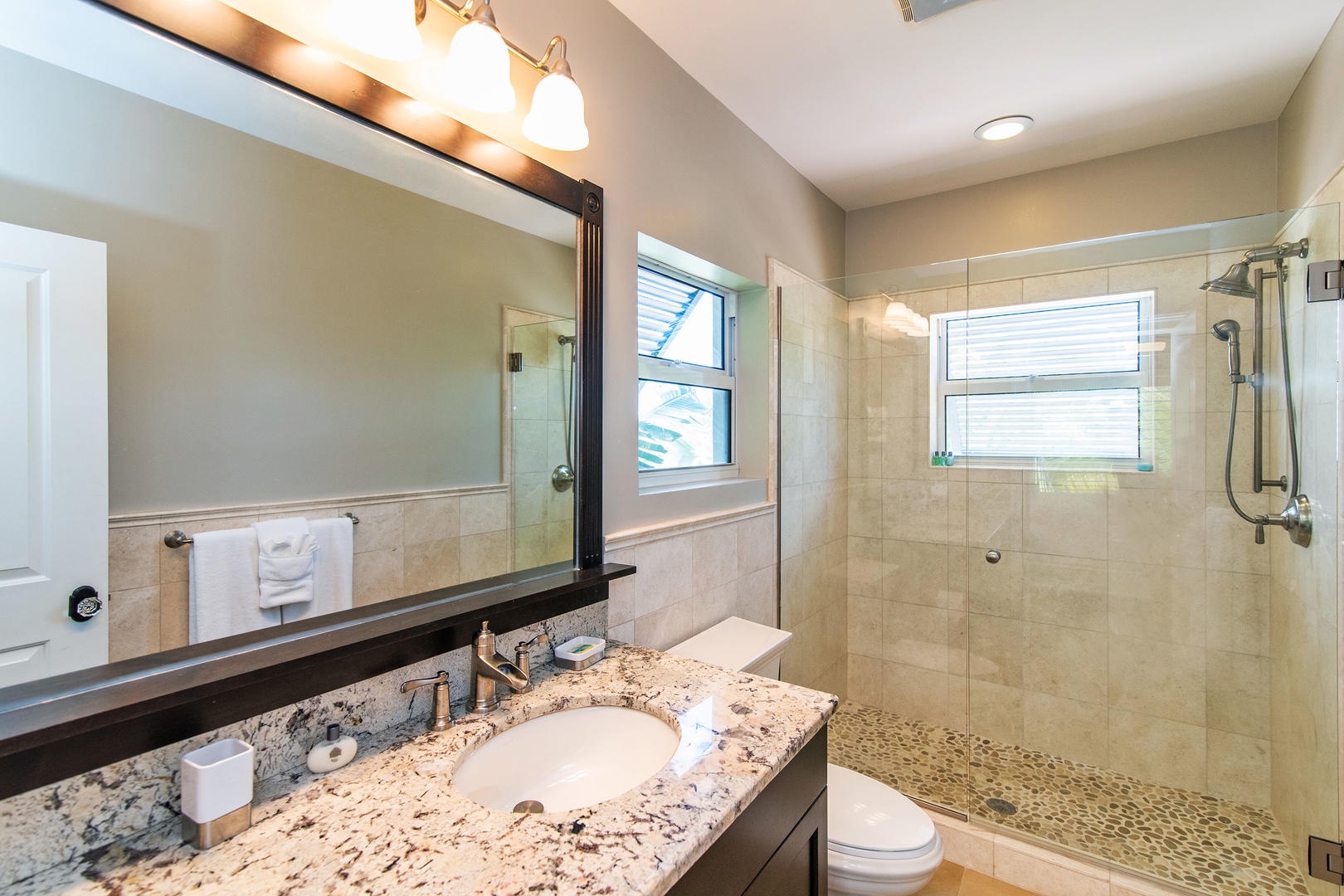 Ensuite bath with glass shower.