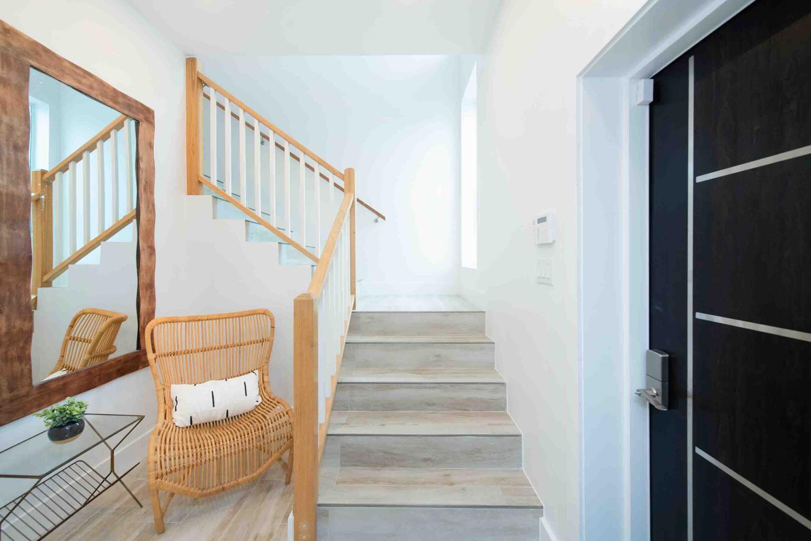 Lower level foyer with stairs to the upper living areas and bedrooms.