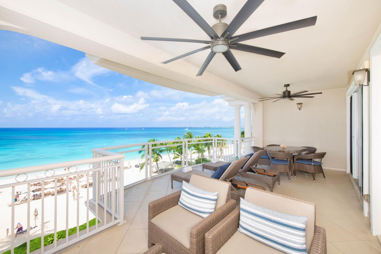 The balcony comes furnished with an alfresco dining table with seating for 5 guests.