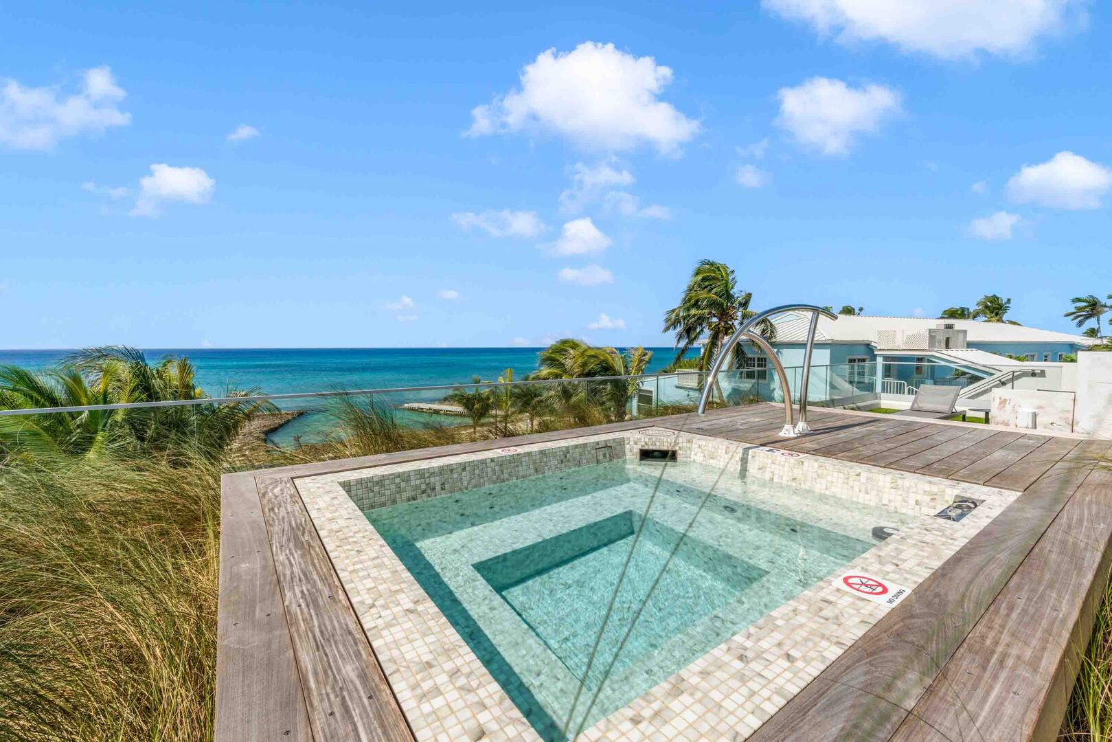 Private jacuzzi overlooking Seven Mile Beach.