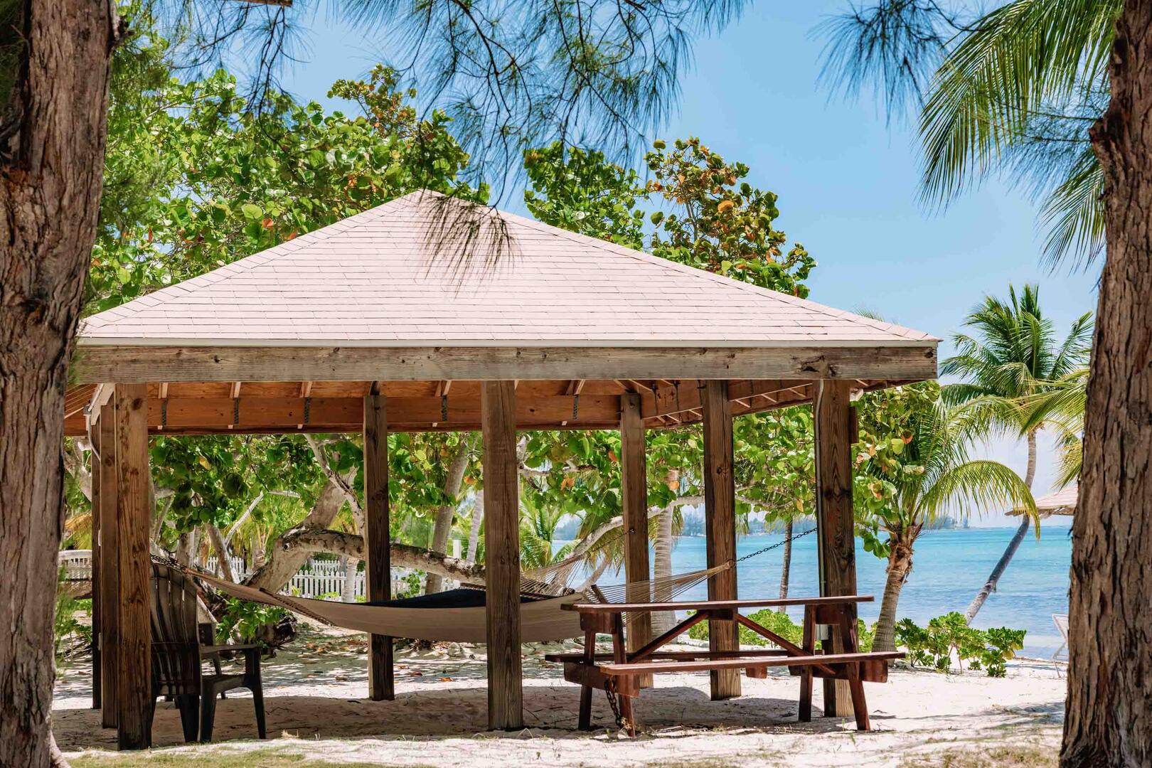 The private beach lot includes this hammock cabana and picnic table.