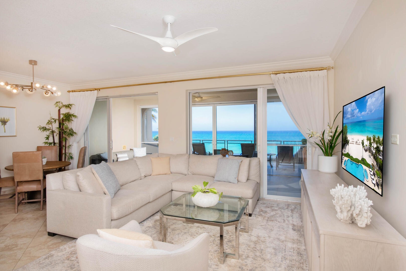 Furnished living area with walkout access to the screened balcony.