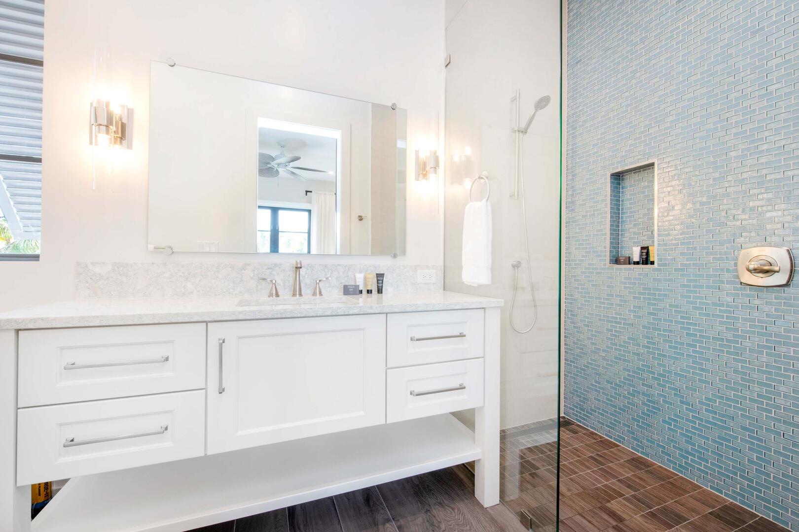 West Veranda Suite ensuite bath with double vanity, and tiled shower.