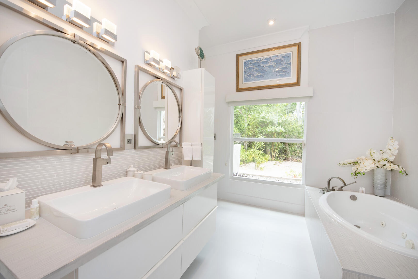 West Master Suite Bathroom with dual vanity, oversized tub, and separate walk-in shower featuring full body shower spa.