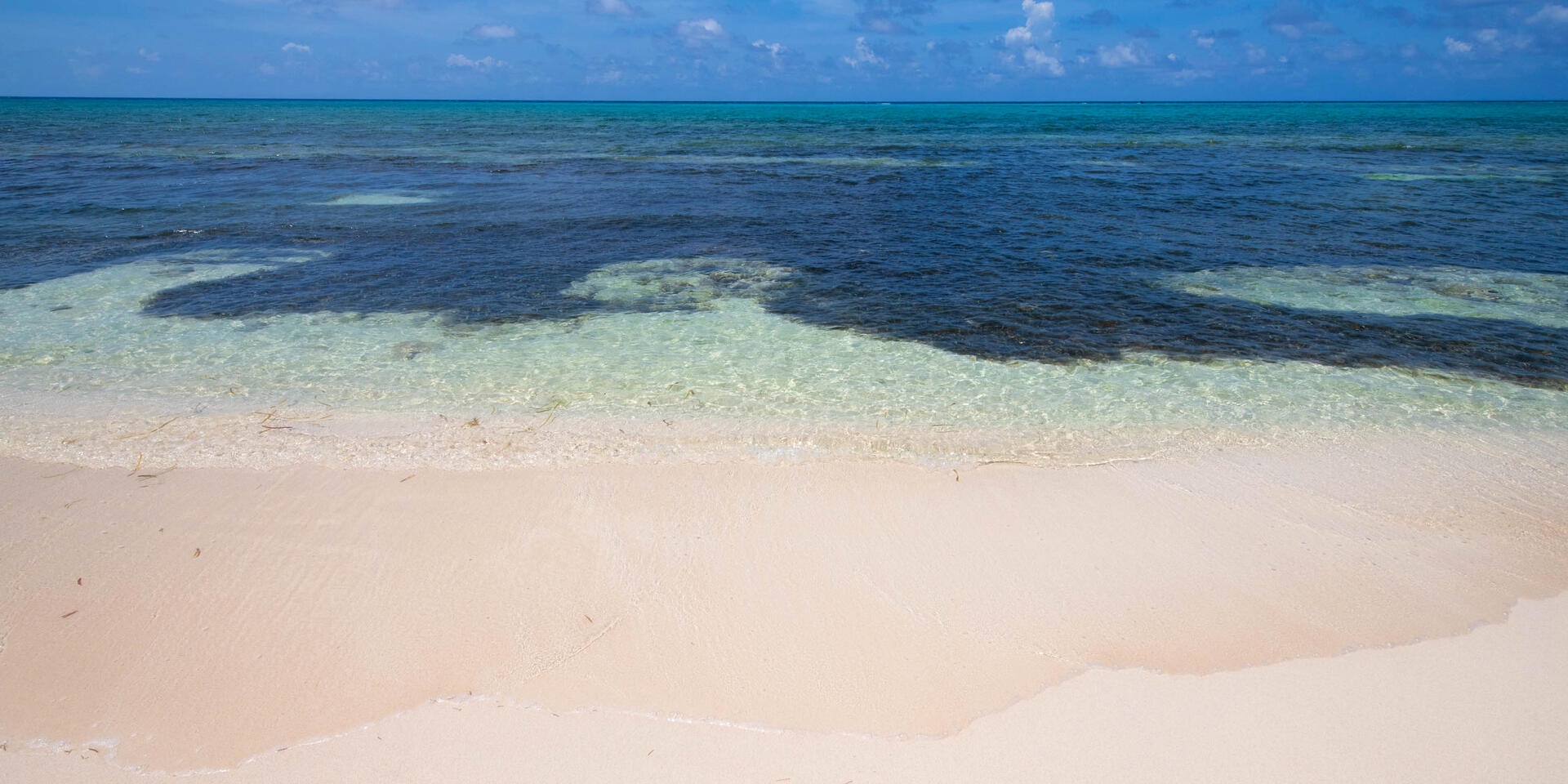 Where the land meets the sea. We recommend guests wear fins or pool shoes when entering the water.