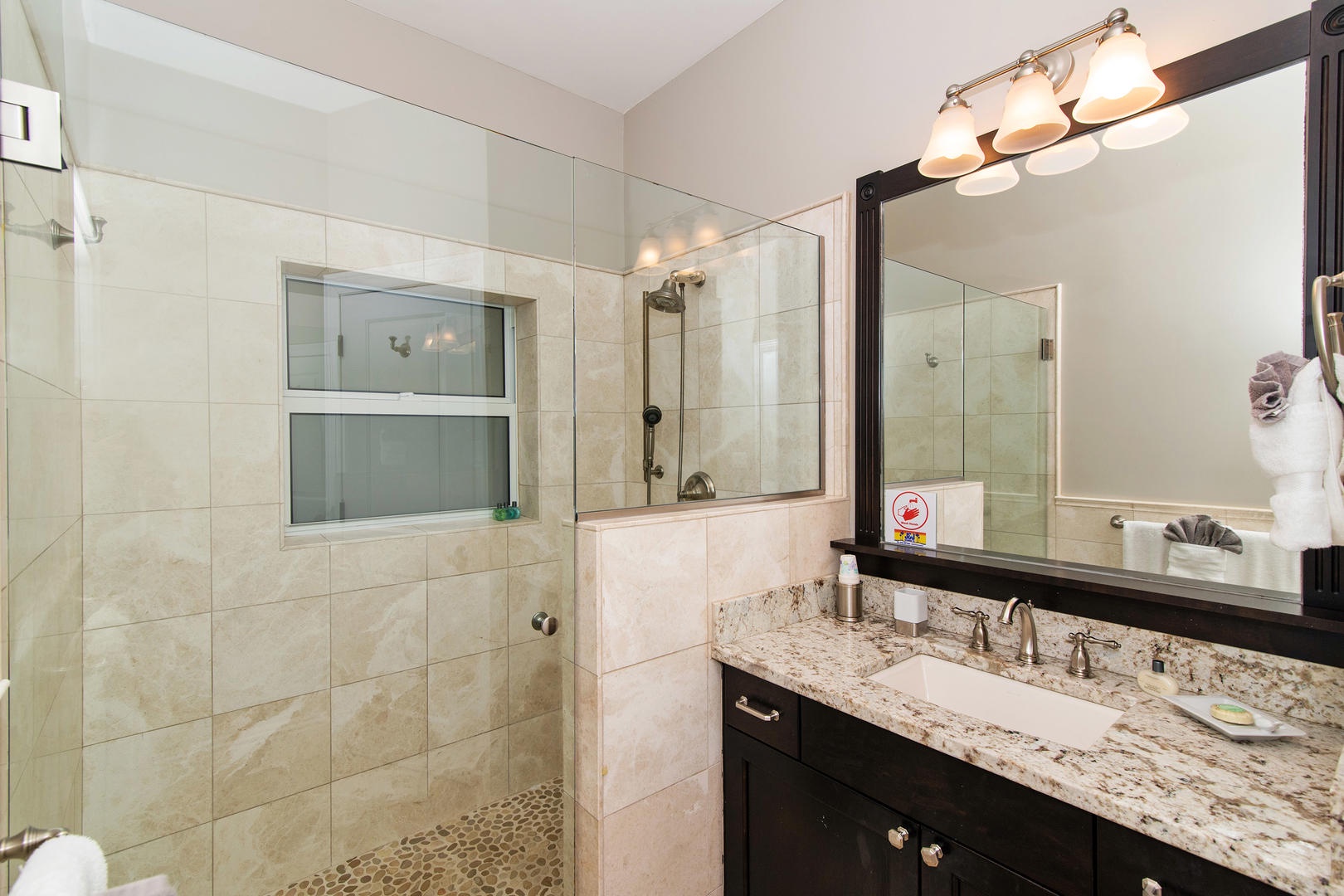 Lower North Suite bathroom with glass shower.