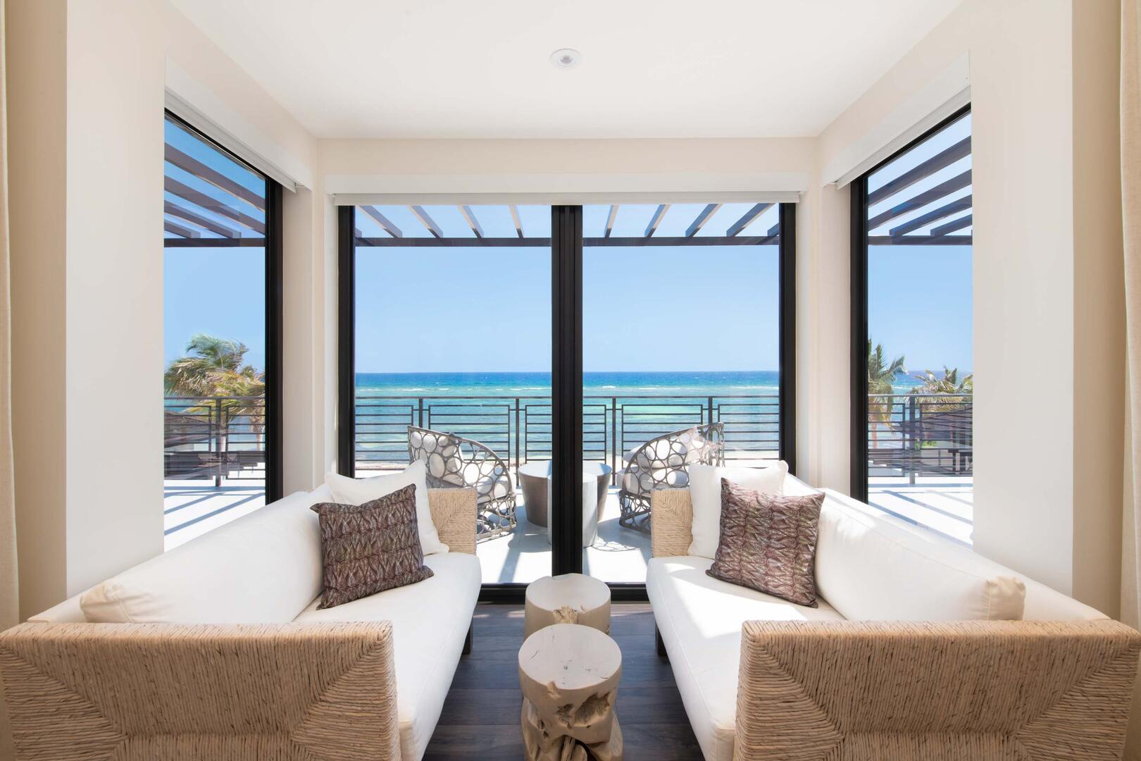 Primary Suite ? upper-level, king bed, oceanfront, vaulted ceilings, walk-out access to oceanfront railed balcony