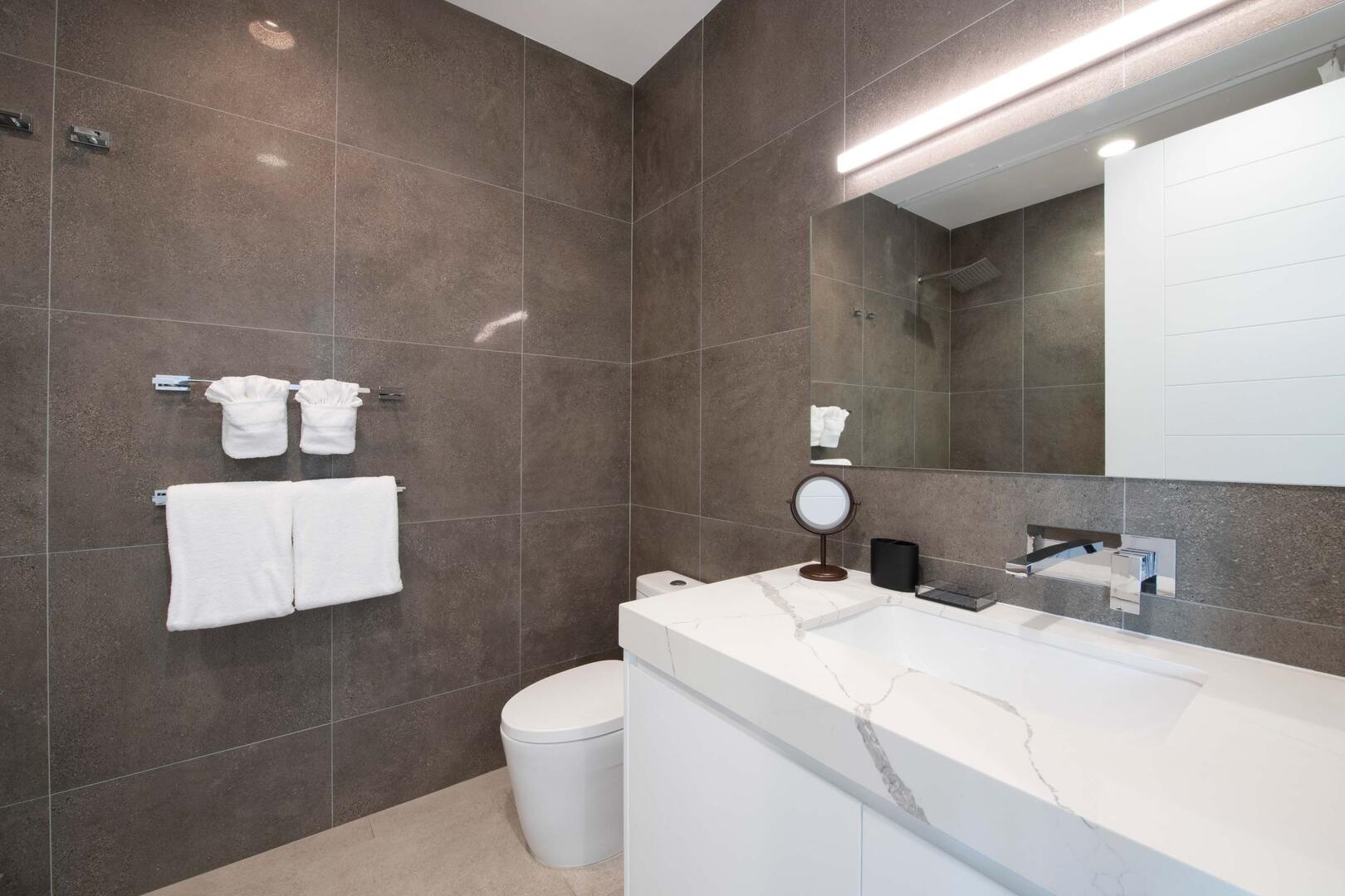 Shared adjacent bathroom for both guest bedrooms.