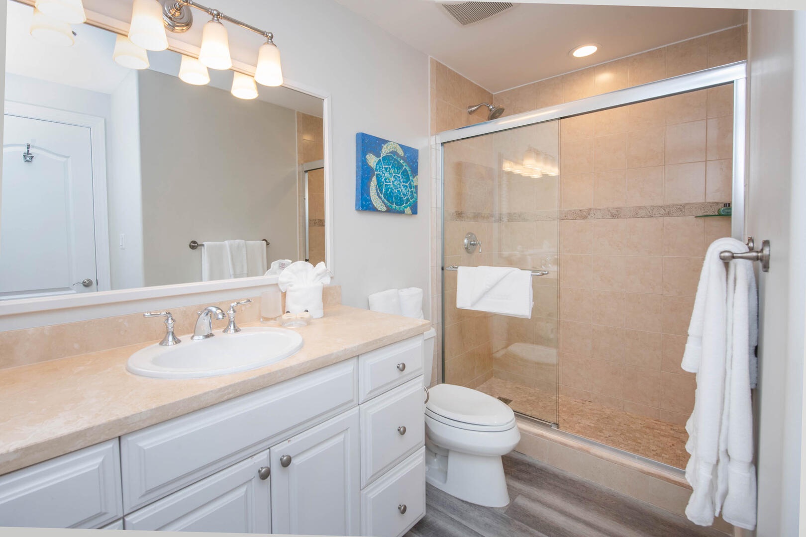 Guest Suite 1 Bathroom with glass shower.