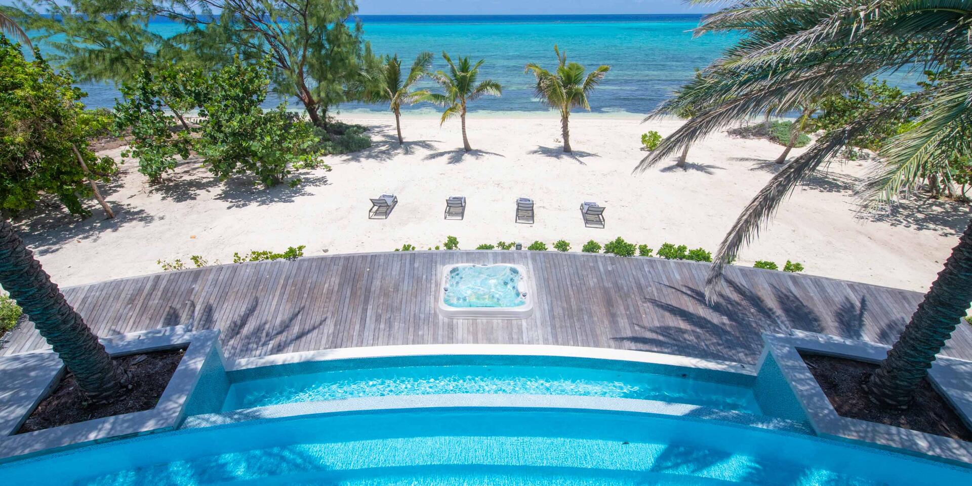 Your private slice of paradise. Backyard beachfront with a sunken in-deck jacuzzi.