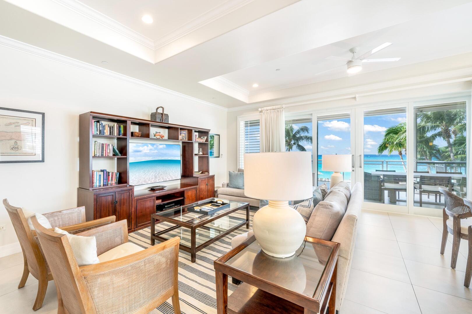 The living area is furnished with sofa seating and an HD cable television.