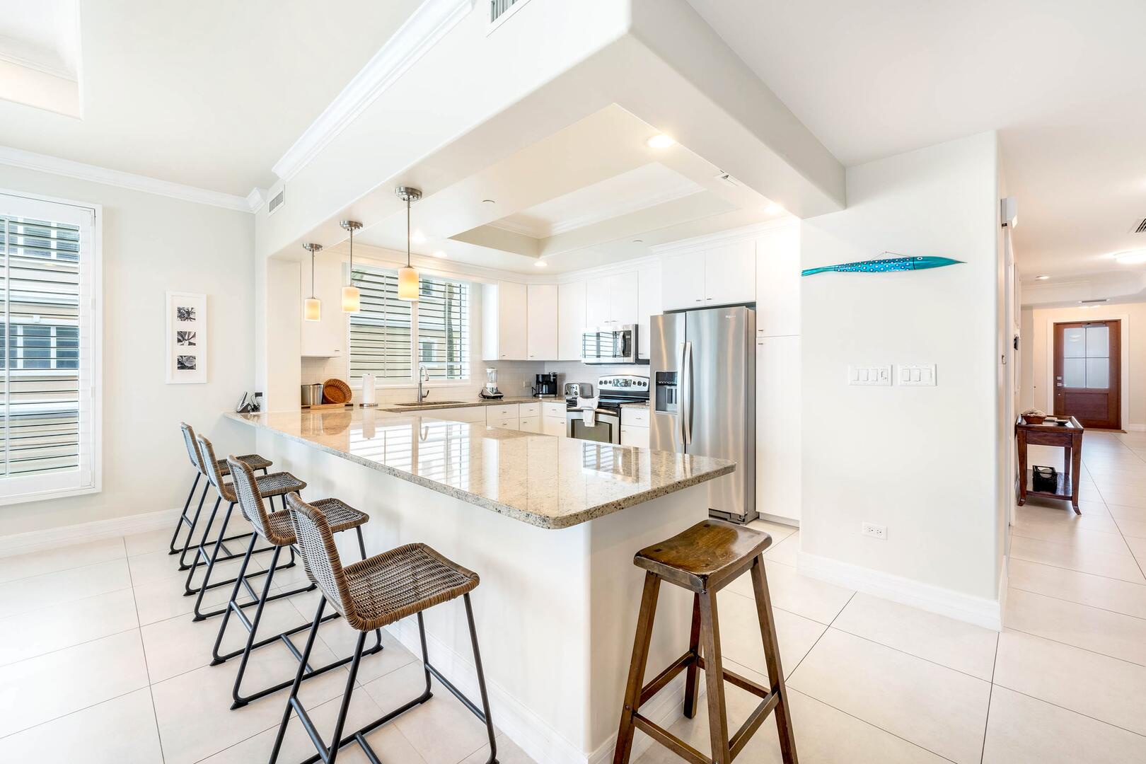 The kitchen comes stocked with dishware, cookware, glassware, and cutlery.