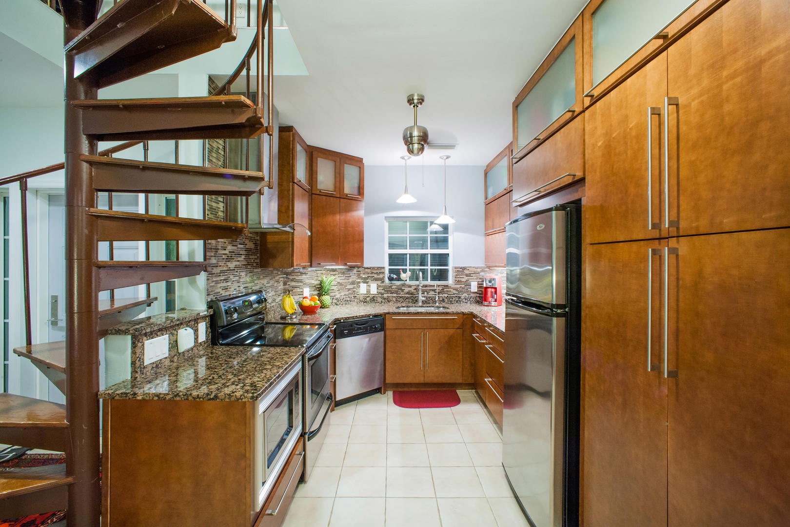 Full kitchen with modern appliances.