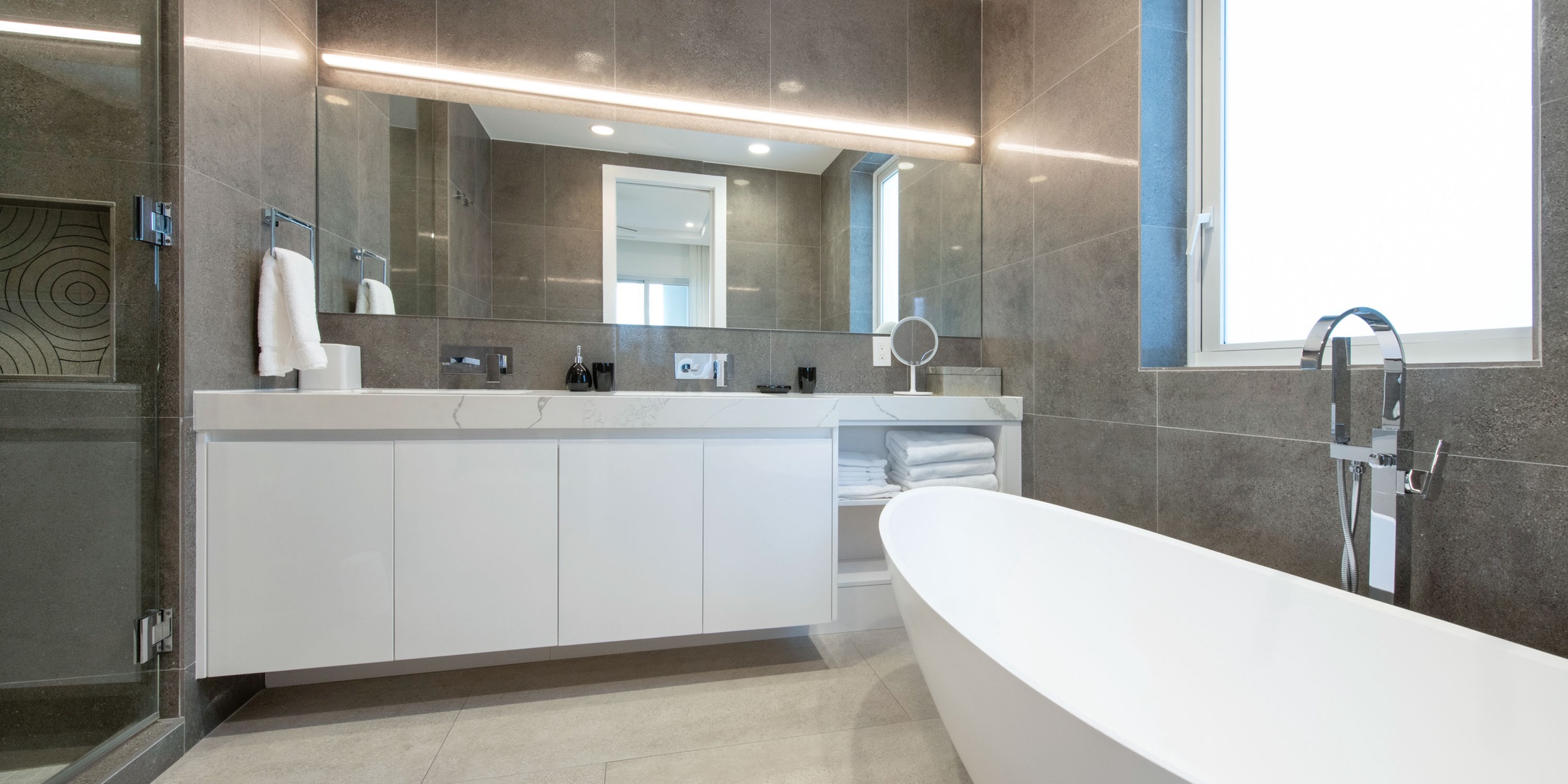 Second primary ensuite with soaking bathtub and shower.