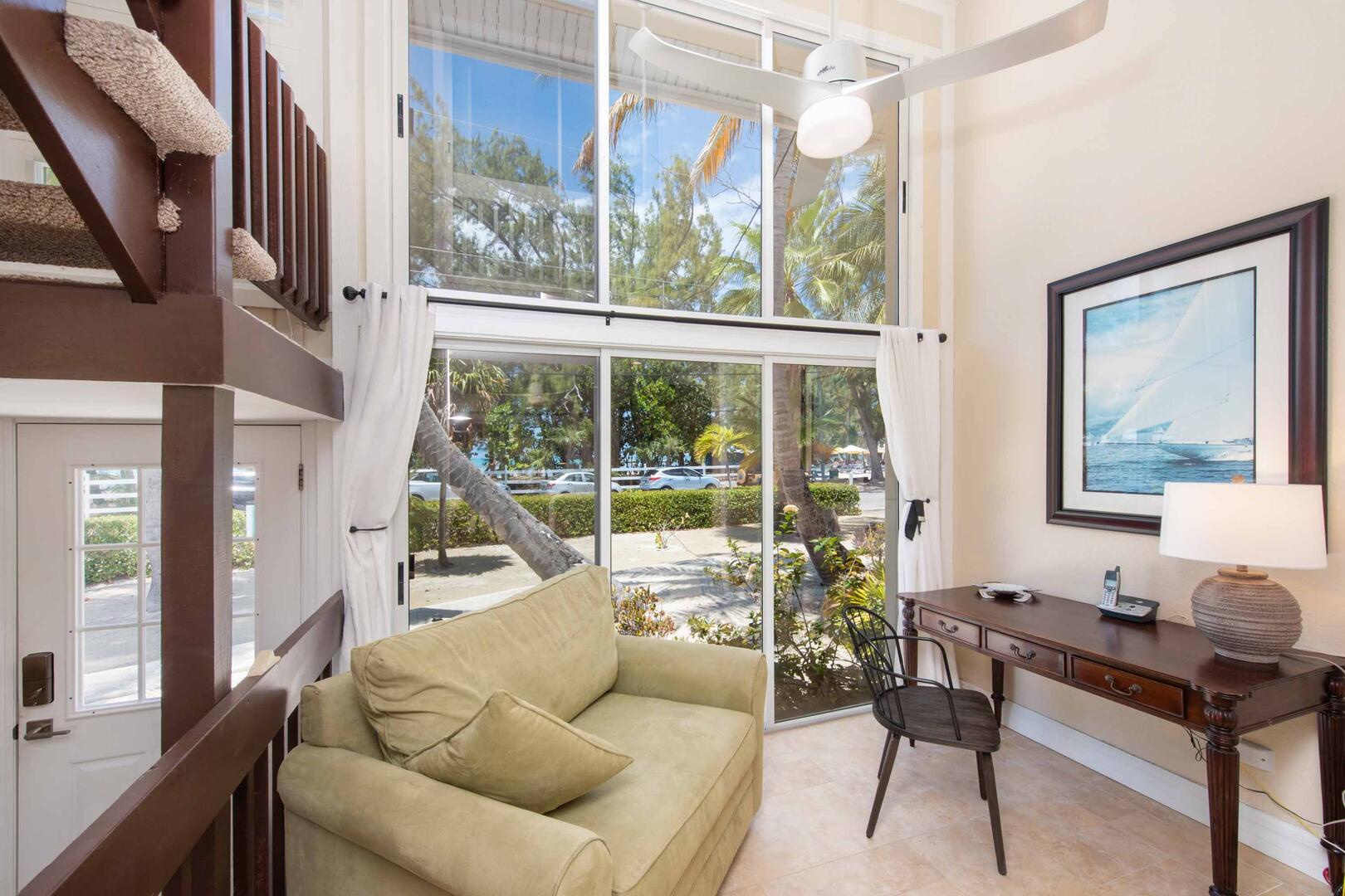 Small study with desk, chair, and island views.