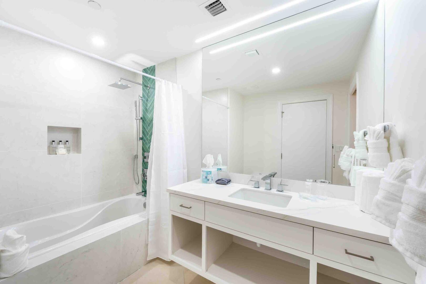 Bedroom 2 ensuite with shower bath. All beach and bath towels, plus bathrobes are provided during your stay.