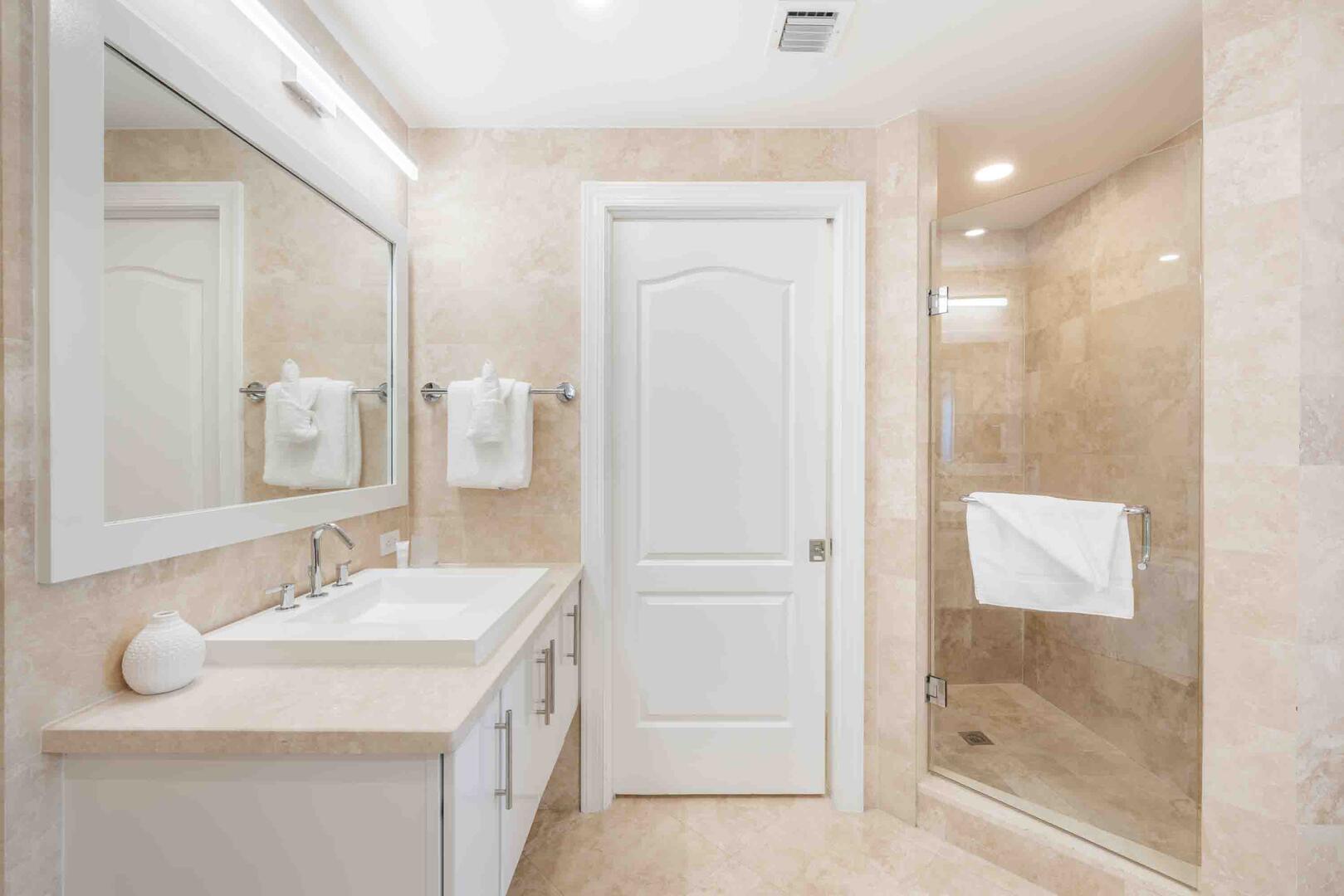 Primary Ensuite shower and water closet. All bath and beach towels are provided during your stay.