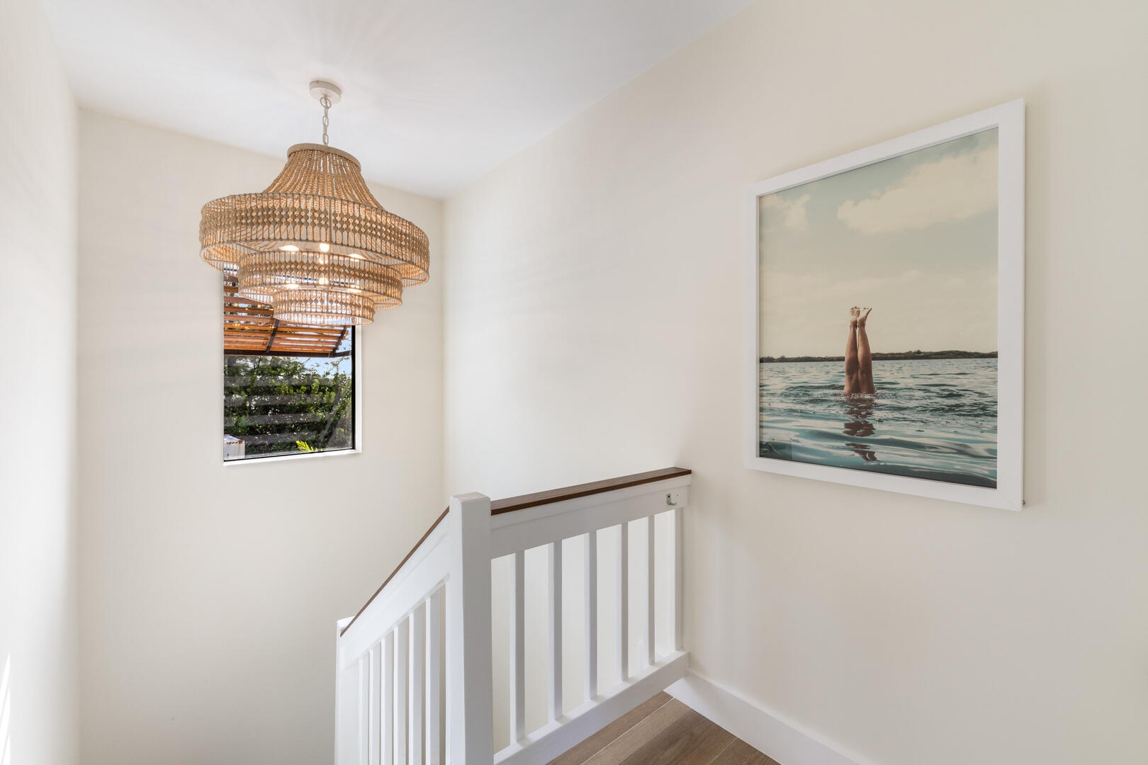 Stairs back down to the lower level living spaces.