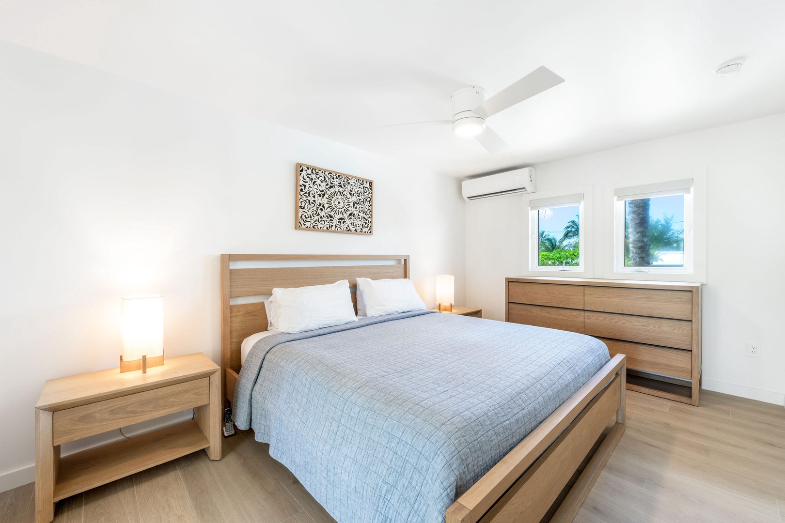 Bedroom 1 with king bed and air conditioning.