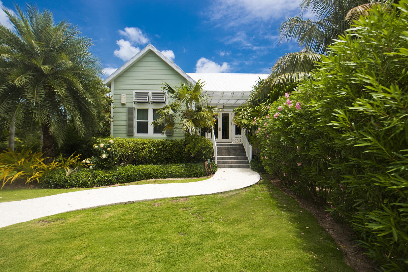 Pomegranate Cottage's exterior has a cute beachy bungalow look to it.