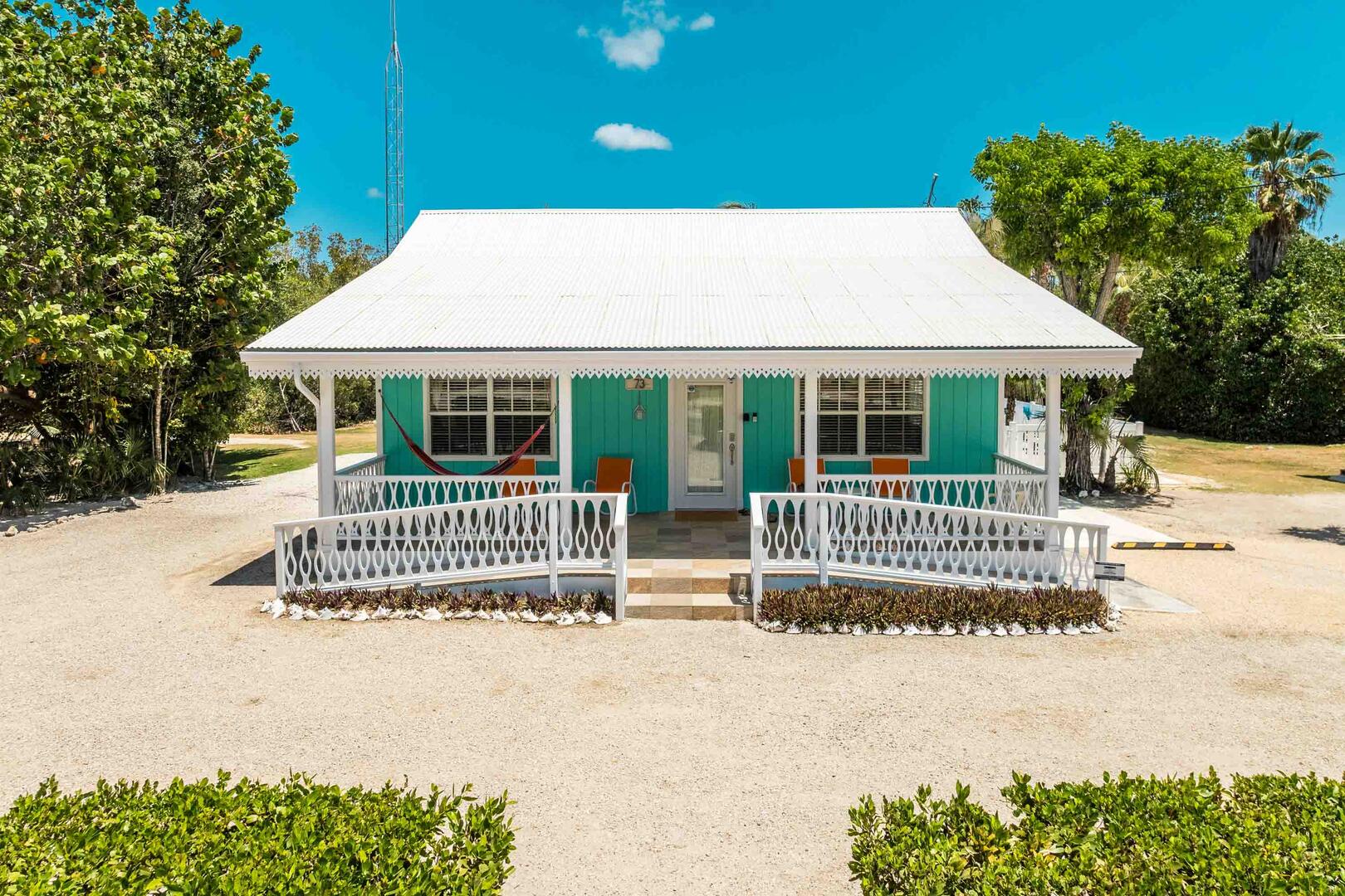 Front entryway with a large driveway.
