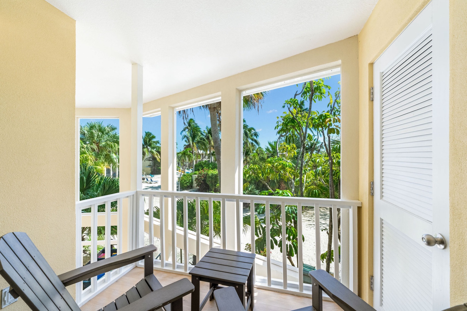 Both bedrooms feature private balconies overlooking the atrium.