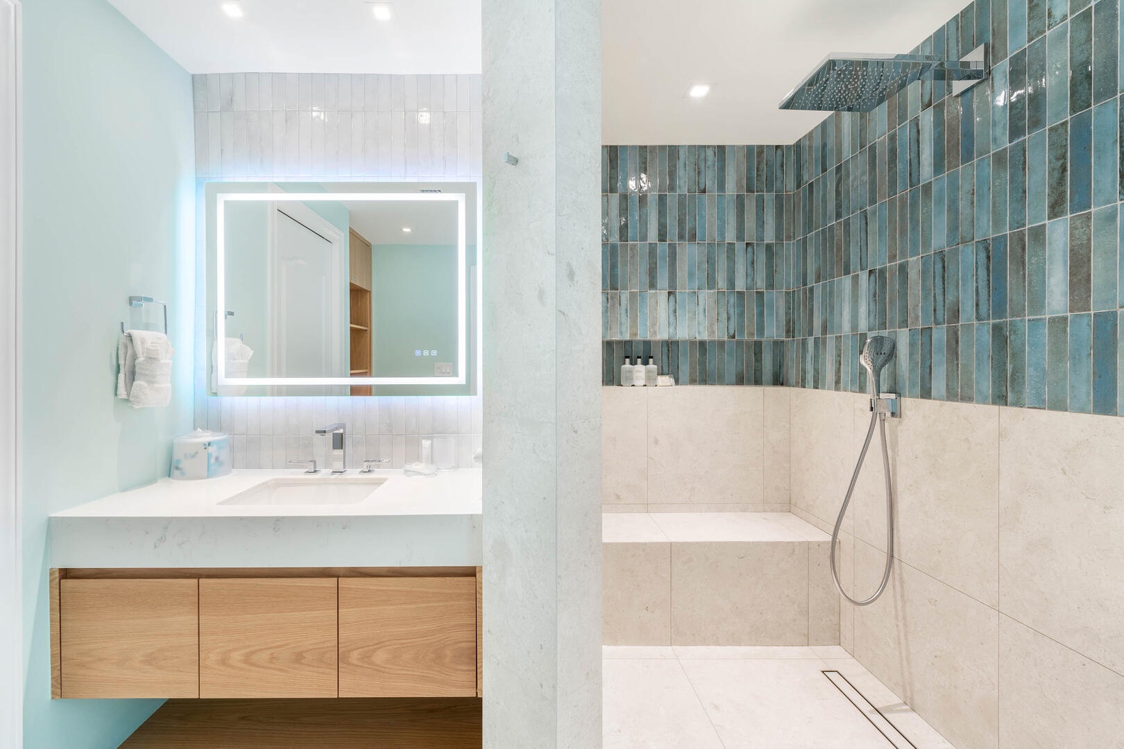 Rainfall shower with water wand and shower bench.