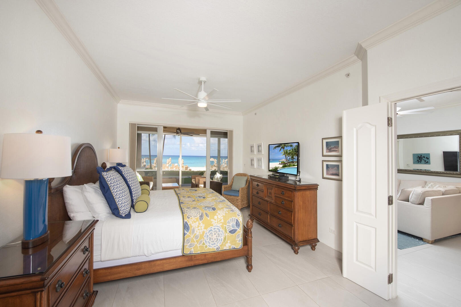 Primary Suite with king bed, ocean views, HD cable TV, and walkout access to the patio.