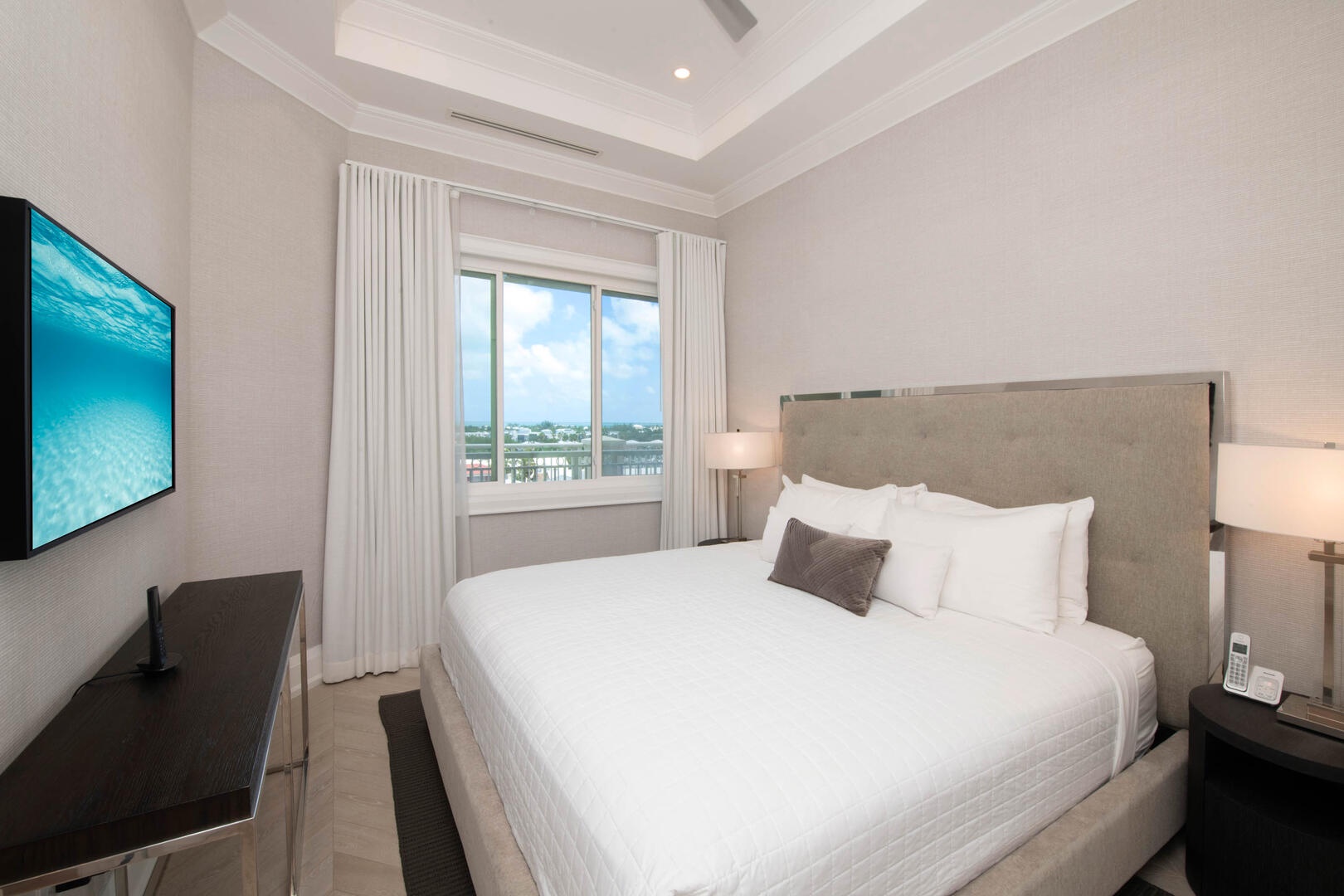 Guest suite #1 with king bed and television.