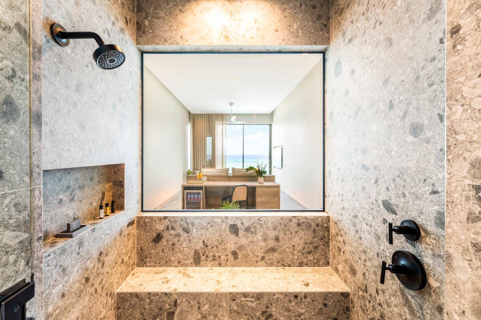 Suite 2 ensuite bathroom with double vanity, multiple mirrors, lighted make-up desk, walk-in oceanview shower