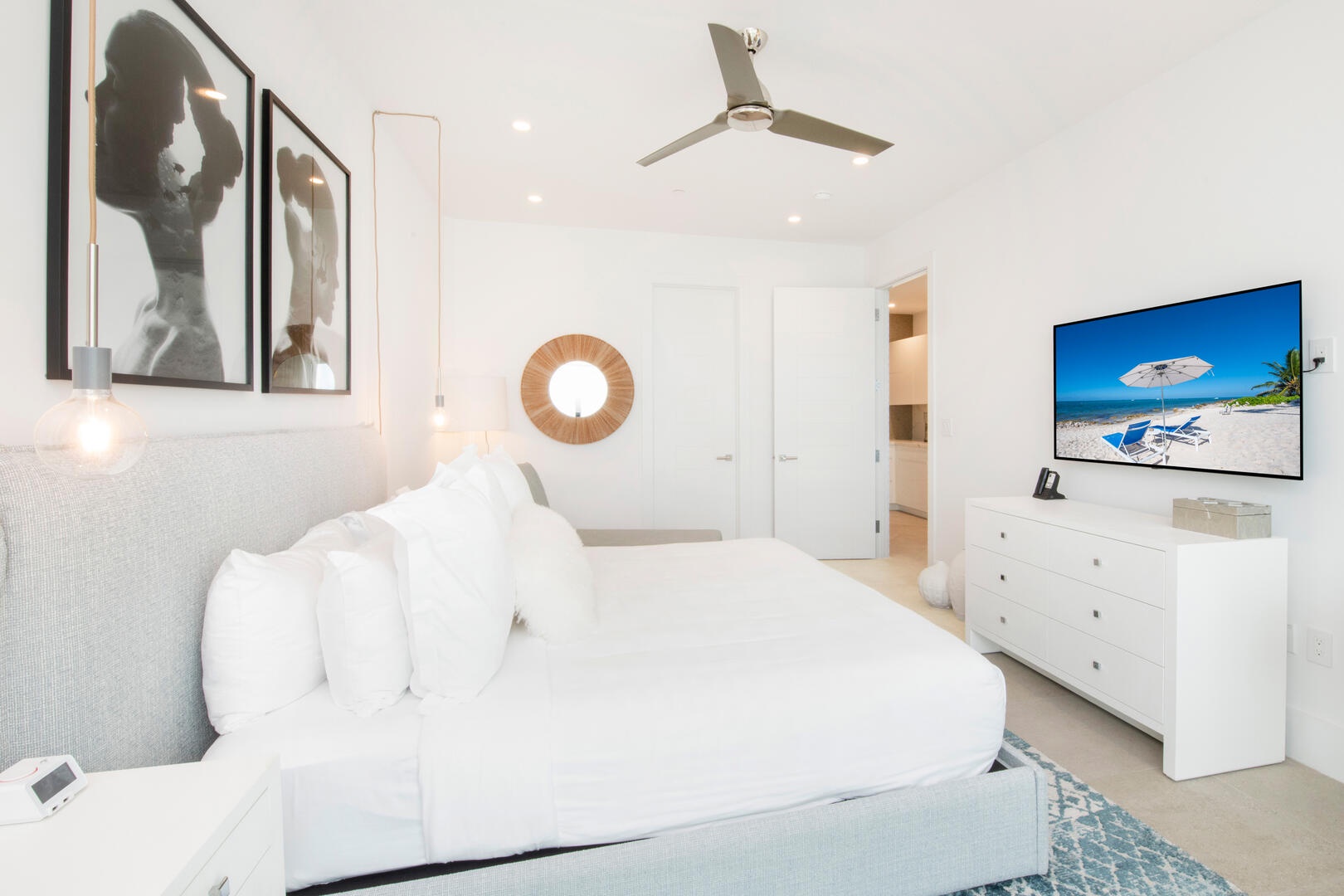 Primary Suite with SmartTV and desk.