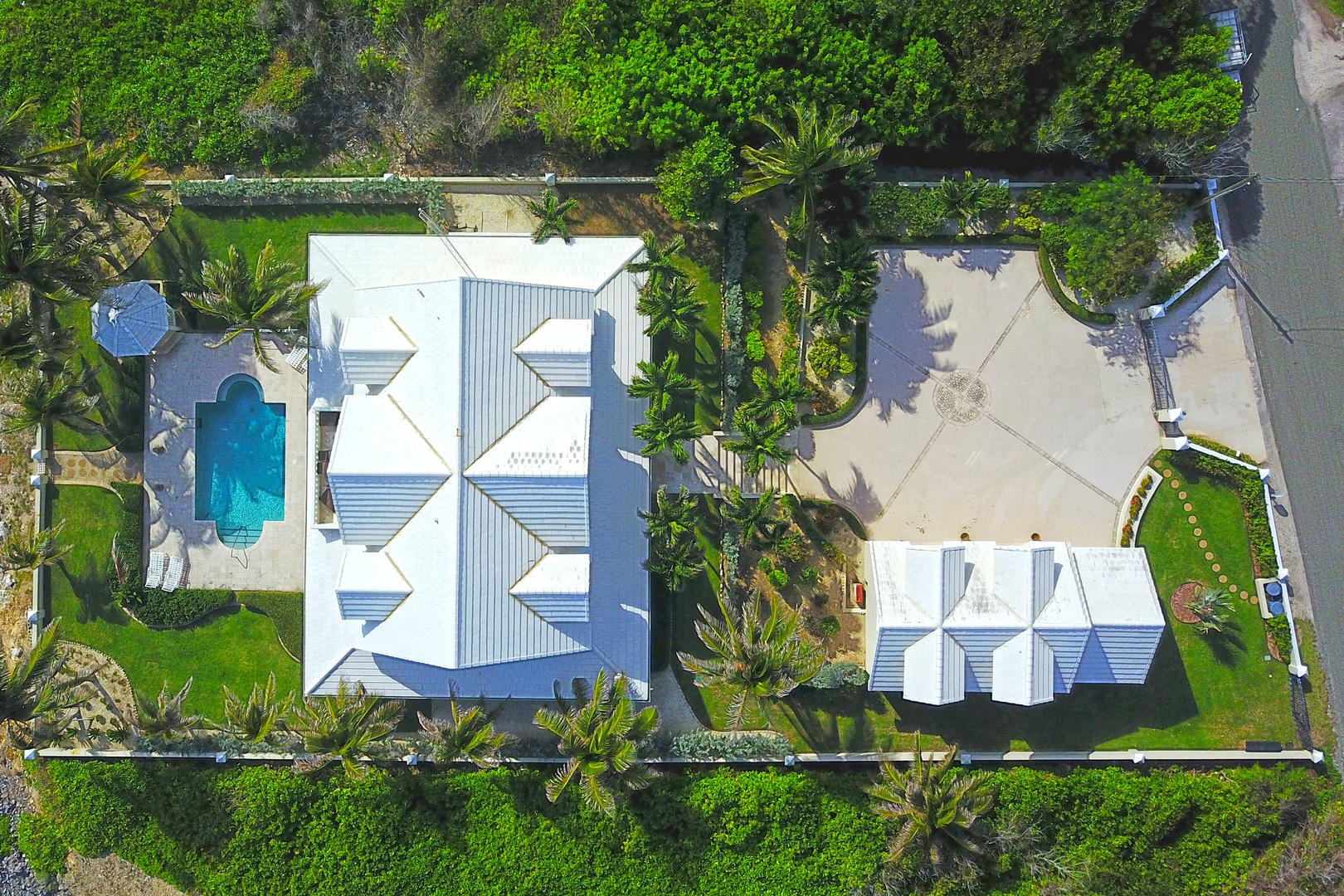 Overhead aerial of the front driveway and pool deck.